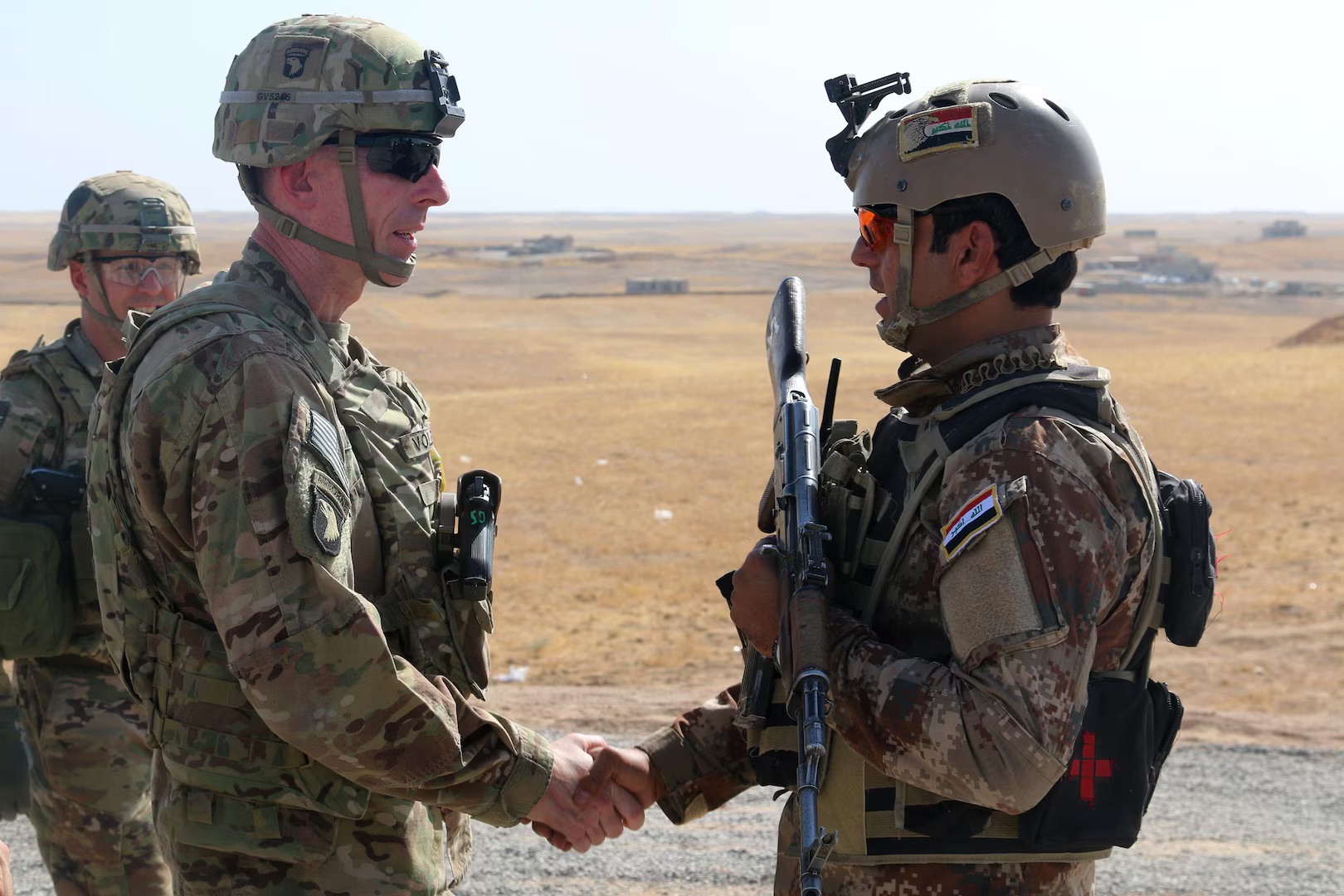 US Army Maj. Gen. visits with an Iraqi soldier at a tactical assembly area in northern Iraq prior to the start of the Mosul offensive