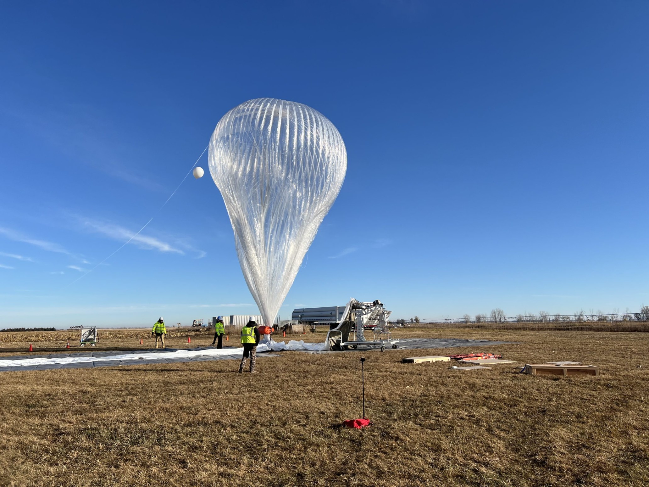 Experts preparing a stratospheric balloon for flight