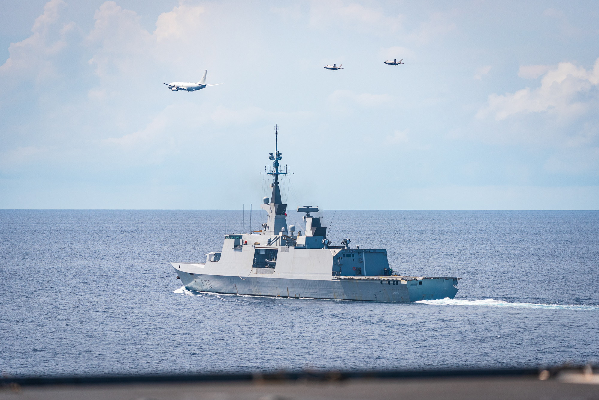 The Royal Australian Air Force conducted a flypast of the French Marine Nationale Frigate La Fayette, and Amphibious Helicopter Dock Dixmude. The flypast consisted of a No. 11 Squadron P-8A Poseidon and two No. 75 Squadron F-35A Lightning II aircraft during a maritime strike and anti-submarine warfare training mission. *** Local Caption *** The Royal Australian Air Force (RAAF) completed a training air maritime integration mission with the Marine Nationale (French Navy) on 5 April 2023 in the Timor Sea. The
