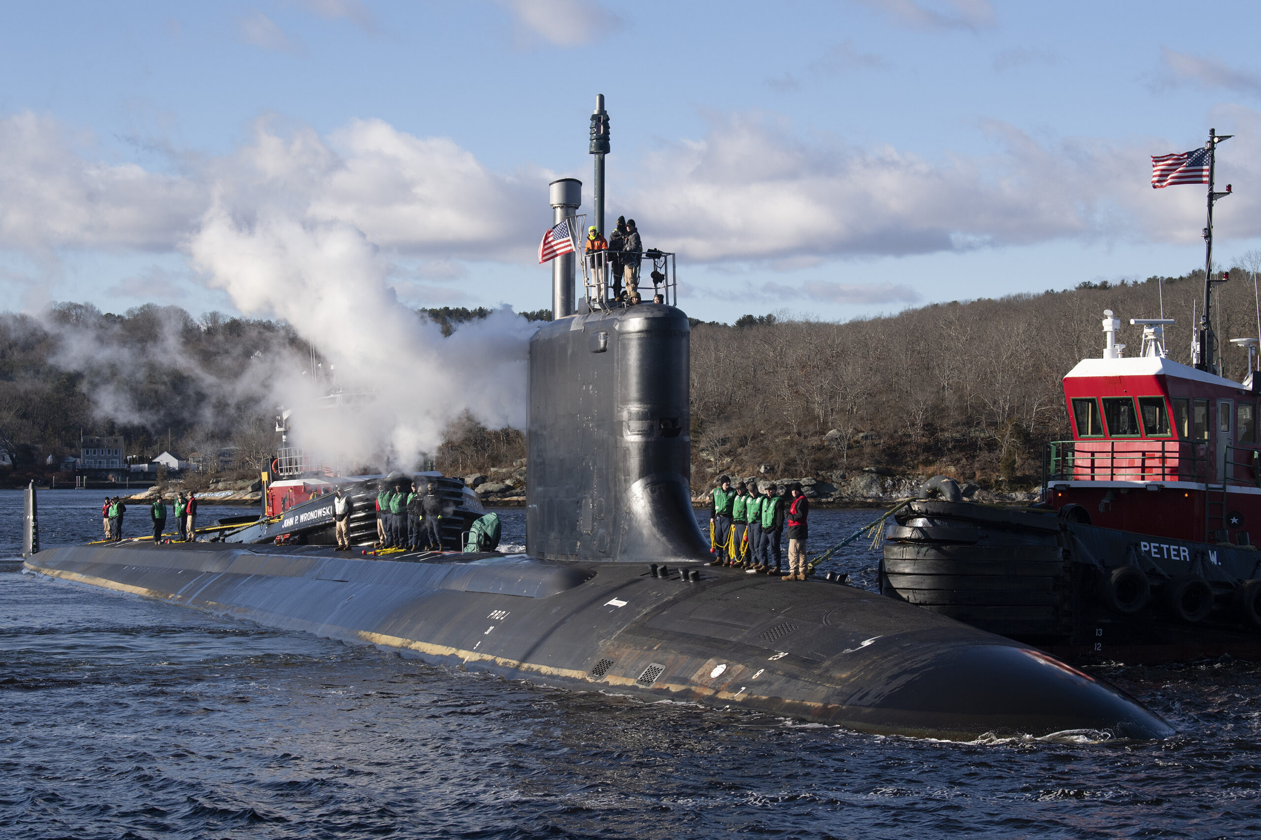 The pre-commissioning unit (PCU) Iowa (SSN 797) arrives for the first time at Naval Submarine Base New London in Groton, Connecticut, December 19, 2024. The future USS Iowa was delivered to Submarine Squadron (SUBRON) 4 from General Dynamics Electric Boat shipbuilding facility down river after recently completing a series of at-sea testing. The fast-attack submarine PCU Iowa and crew operate under SUBRON 4 and its primary mission is to provide fast-attack submarines that are ready, prepared, and committed to meet the unique challenges of undersea combat and deployed operations in unforgiving environments across the globe. (U.S. Navy photo by John Narewski)