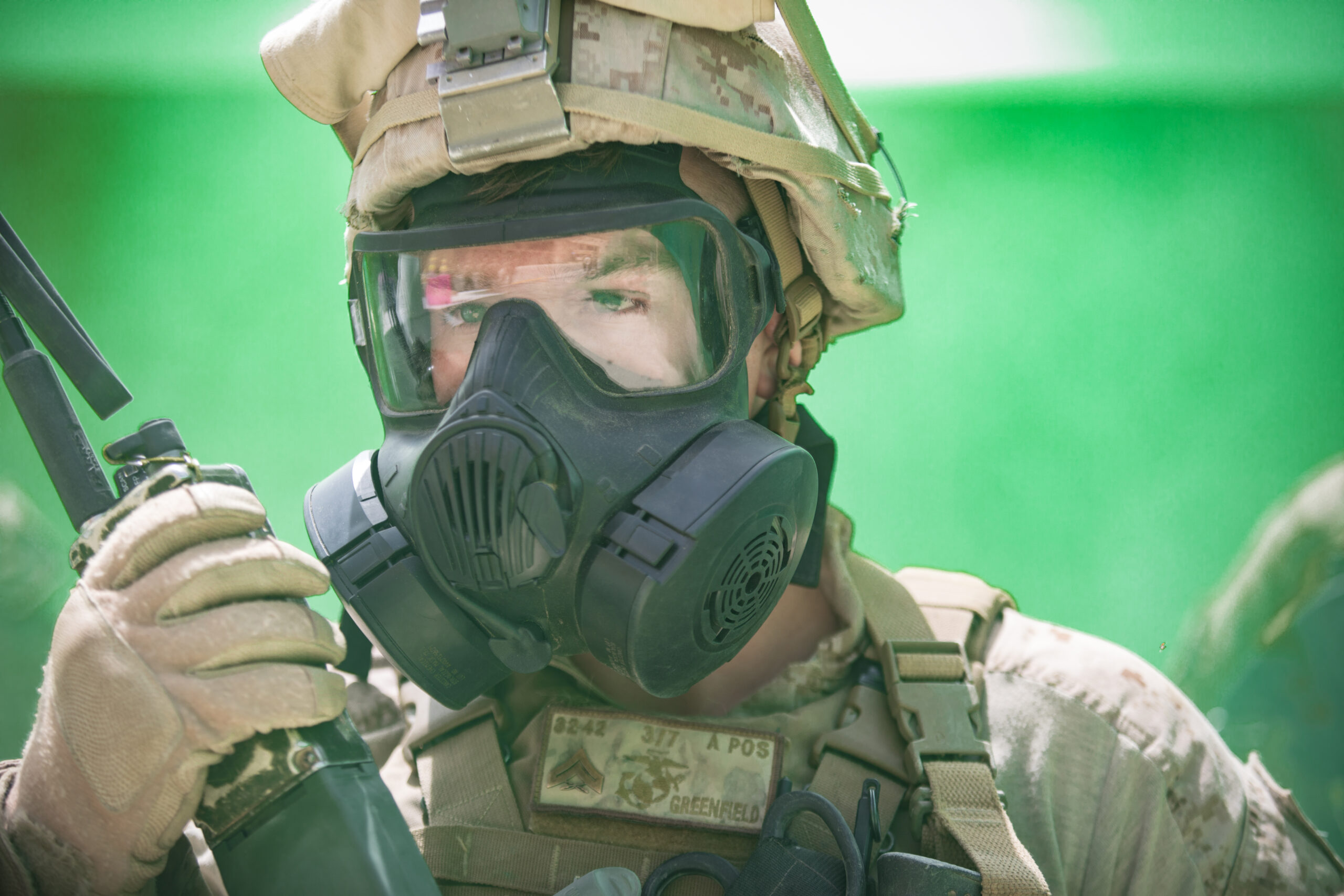 UNDISCLOSED LOCATION, MIDDLE EAST – U.S. Marine Corps Cpl. Jamie M. Greenfield, an infantry assault Marine with 3rd Battalion 7th Marine Regiment, attached to Special Purpose Marine Air-Ground Task Force, Crisis Response-Central Command, operates a radio during a simulated gas attack July 25, 2018. The Marines exercised their chemical, biological, radiological, and nuclear defense training during exercise Lucky Seahorse. (U.S. Marine Corps photo by Cpl. Teagan Fredericks)