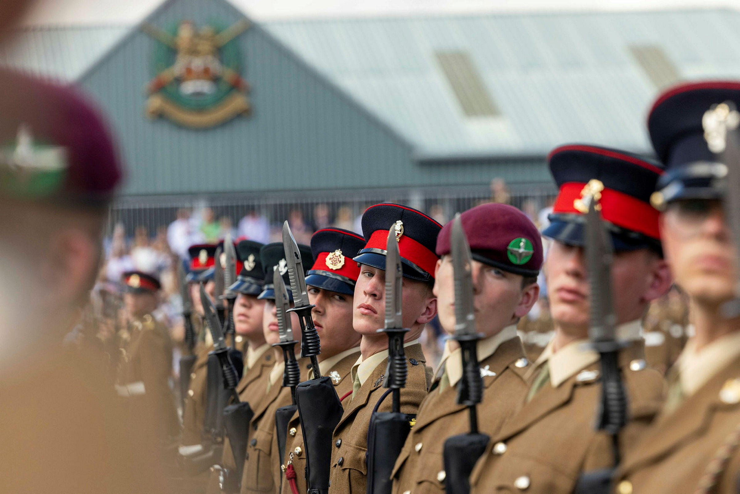 The troops conduct the drill movement in open order on parade with the colours, at the pass out parade in Army Foundation College (AFC) Harrogate. More than 400 marched onto the parade square to mark the successful completion of their Phase One training. The prestigious ceremony is the culmination of months of intensive training, nurturing and education that is tailored exclusively to junior soldiers. Their final exercise is an intense, seven-day battle camp encompassing all they have learnt during their time at AFC Harrogate. The 17 and 18-year-olds will now go on to complete their trade training before joining regiments across the UK. The College based at Uniacke Barracks in Harrogate, North Yorkshire, provides a unique combination of military basic training and vocational training. It has two intakes a year in March and September and runs two types of courses. A 49-week course (including eight weeks holiday) for those joining the infantry, Royal Armoured Corps/Household Cavalry, Royal Artillery and some Royal Logistic Corps roles. A 23-week course (including three weeks holiday) for those joining courses with longer Phase 2 training – these are Royal Electrical and Mechanical Engineers, Royal Engineers, Royal Signals, Adjutant General’s Corps, Royal Army Medical Corps, Army Air Corps and some Royal Logistic Corps roles. The military training syllabus teaches the Junior Soldiers the basics of soldiering, from how to look after their kit to how to safely handle and fire an assault rifle. They learn fieldcraft and take part in military exercises.