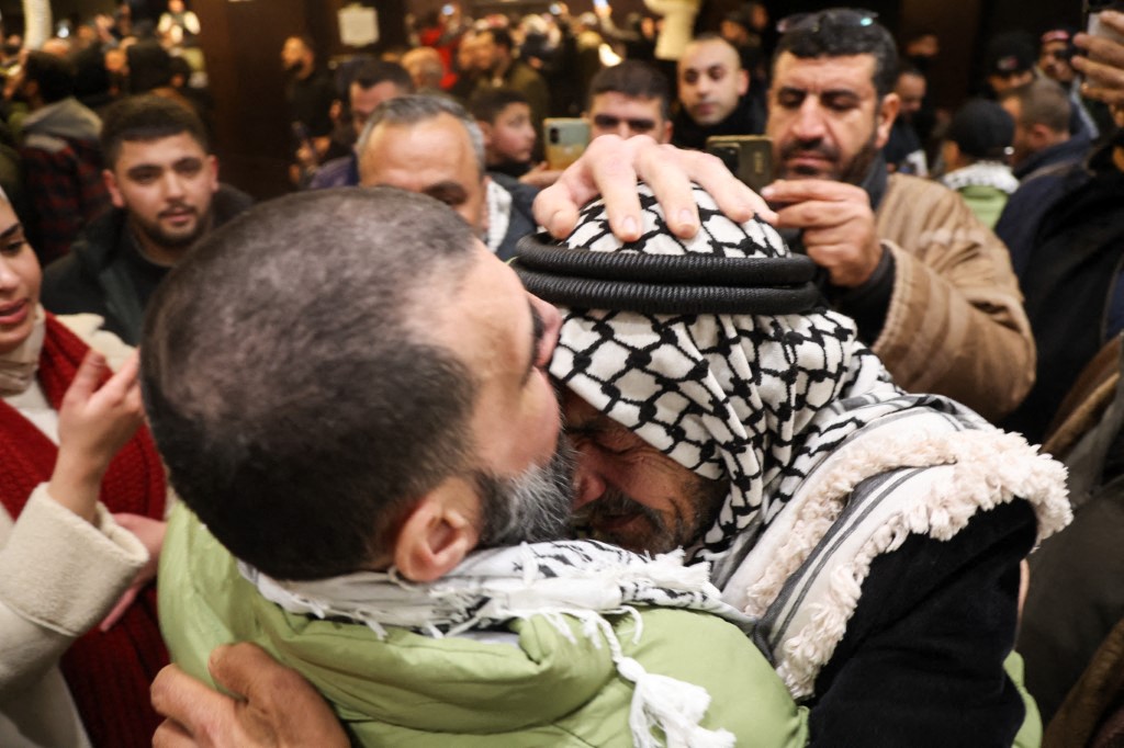 Friends and family members welcome one of the Palestinian prisoners released from Israel's prisons in return for the handover of bodies of 4 Israeli hostages by Hamas to the Red Cross in Ramallah, West Bank on February 26, 2025. (Photo by Mohammad Nazal / Middle East Images / Middle East Images via AFP)