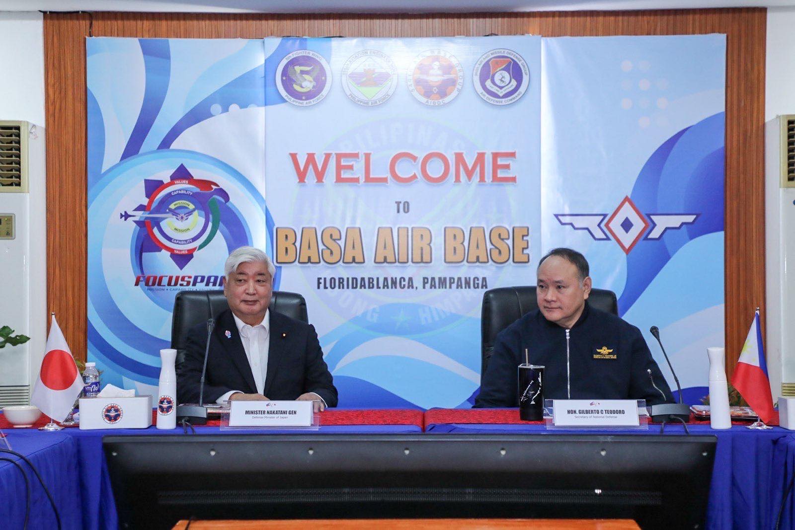 Japanese defense minister Nakatani Gen and his Philippine counterpart Gilberto Teodoro Jr. seated beside each other at the Philippine Basa Air Base