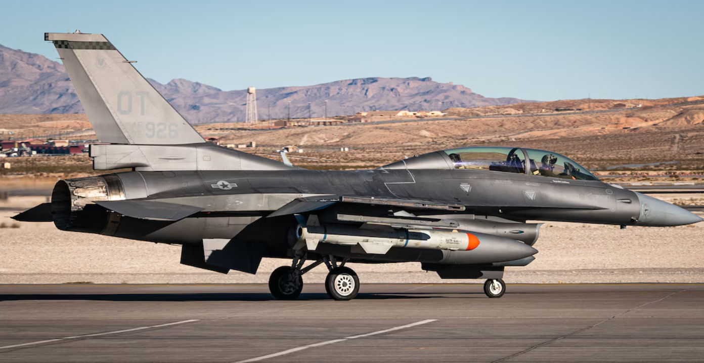 An F-16 Fighting Falcon assigned to the 53rd Test and Evaluation Group taxies with a U.S. Navy Harpoon missile system equipped at Nellis Air Force Base, Nevada.