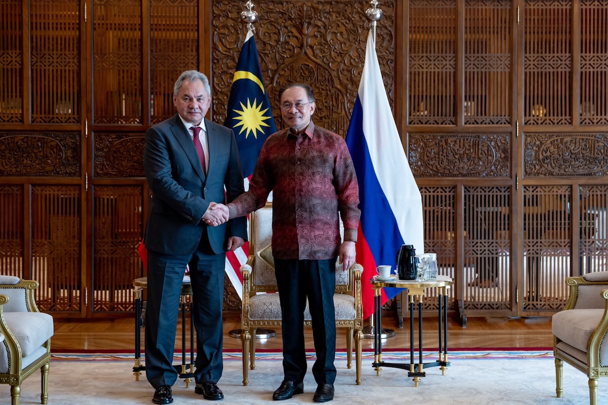 Russian Security Council Secretary Sergei Shoigu shaking hands with Malaysian Prime Minister Anwar Ibrahim during a courtesy call.