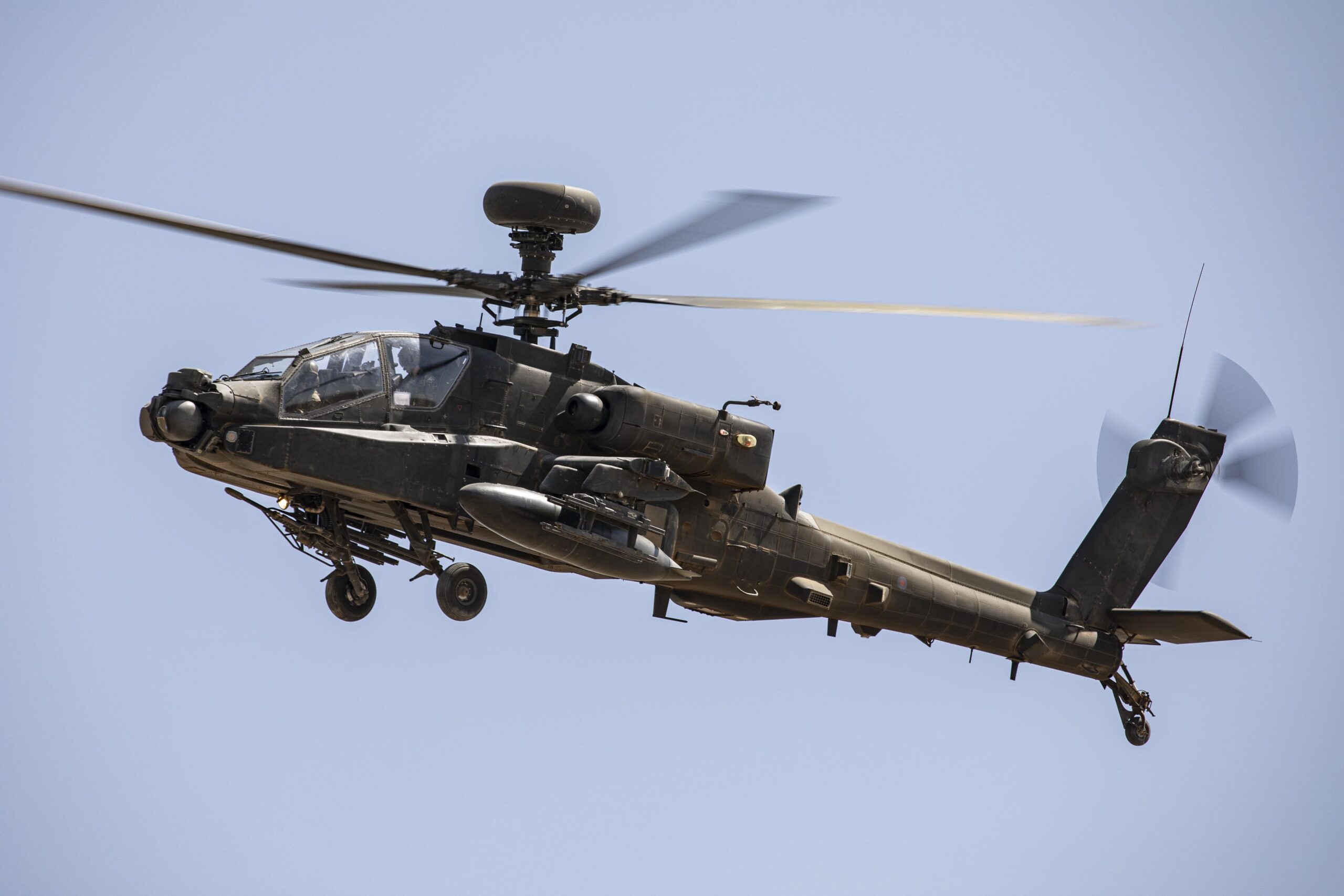The AH64 Apache conducts dust landings while deployed to RAFO Musannah as part of Ex PINION OMAN 21. Force elements from across the 1st Aviation Brigade Combat Team (1AvnBCT) recently deployed on Exercise PINION OMAN 21 (ExPO21) to conduct essential desert environmental training and live firing prior to supporting 1 (UK) Division on Exercise KHANJAR OMAN 21. The training and qualifications also ensure lead elements of 1AvnBCT who are held are Extremely High Readiness are equipped to react to a multitude of potential threats, able to deploy globally as well as support standing operational commitments in the homeland. In order to support the deployment, maintain serviceability and readiness of the aircraft, personnel from the Army Air Corps, Royal Electrical and Mechanical Engineers, Royal Logistics Corps, Royal Air Force and Royal Navy work day and night in challenging conditions to conduct vital maintenance, repair, refuel and support. These personnel are the vital enablers which assure that each aircraft is maintained to the highest standard and set the conditions for the aircrew to continuingly fly in some of the harshest conditions in the world.