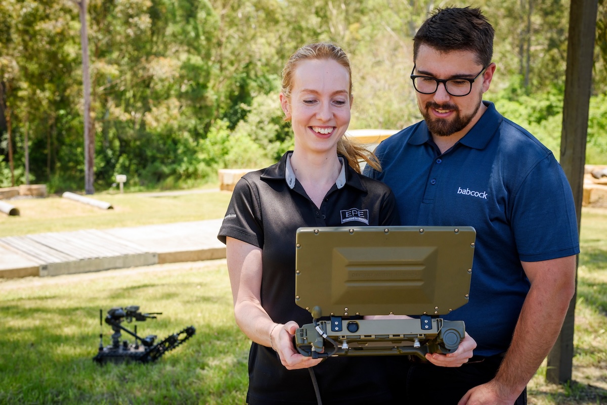 Representatives from Babcock and EPE operate the Squad Packable Utility Robots (SPUR) Remote Positioning Vehicles – Light