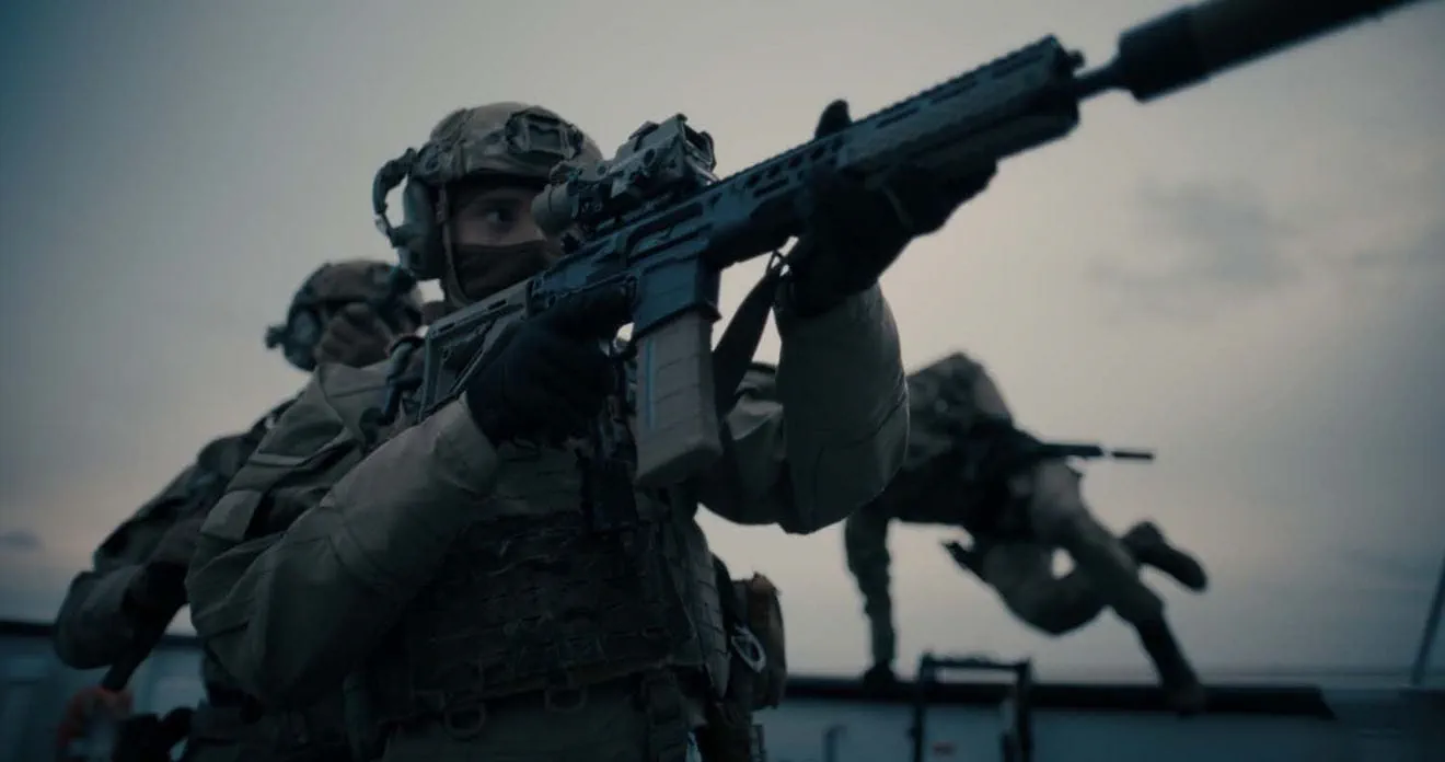 A British soldier holding a rifle