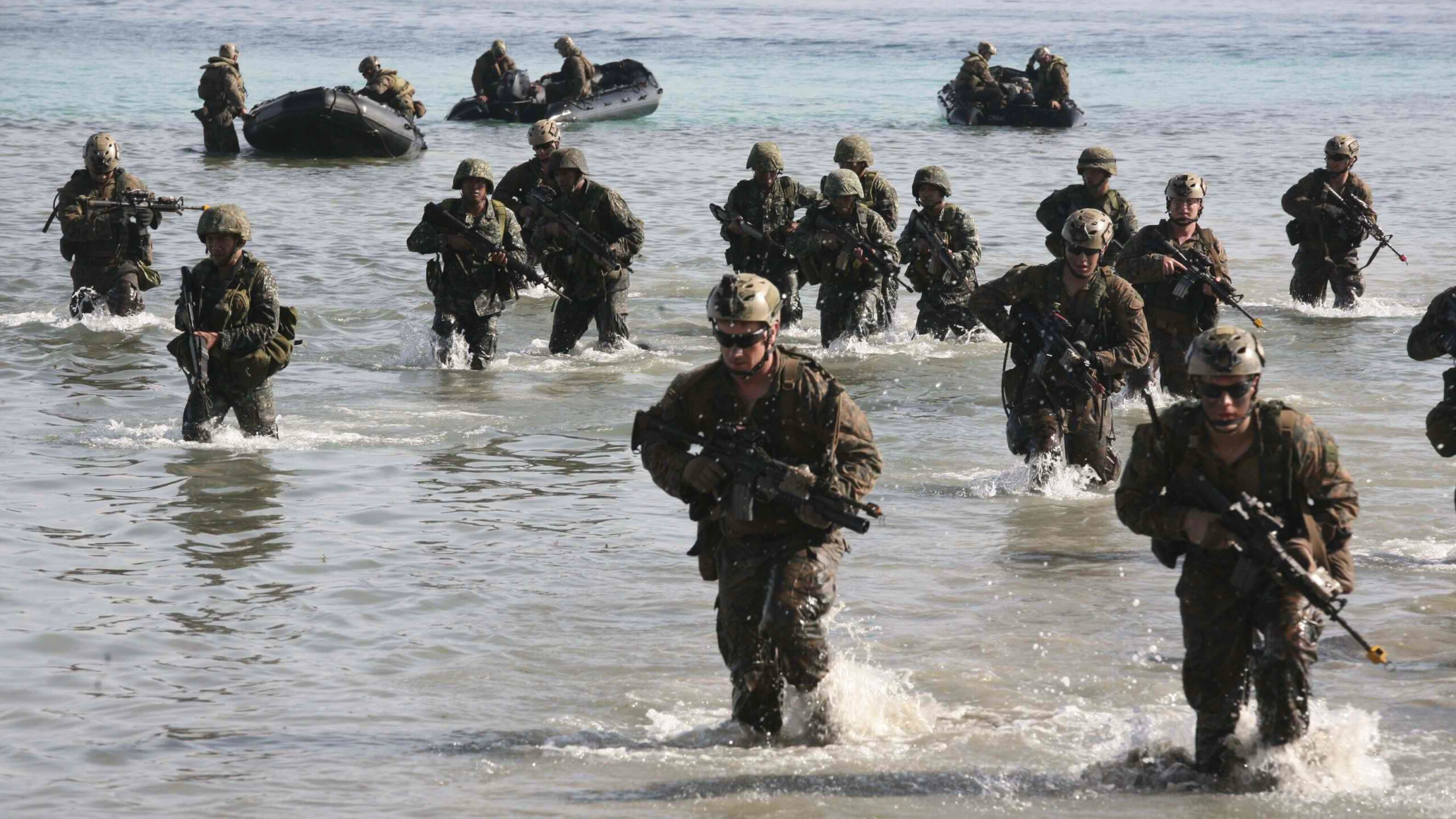 Philippine and US Marines simulate a beach landing from combat rubber raiding crafts onto a small island off the coast of Palawan, Philippines