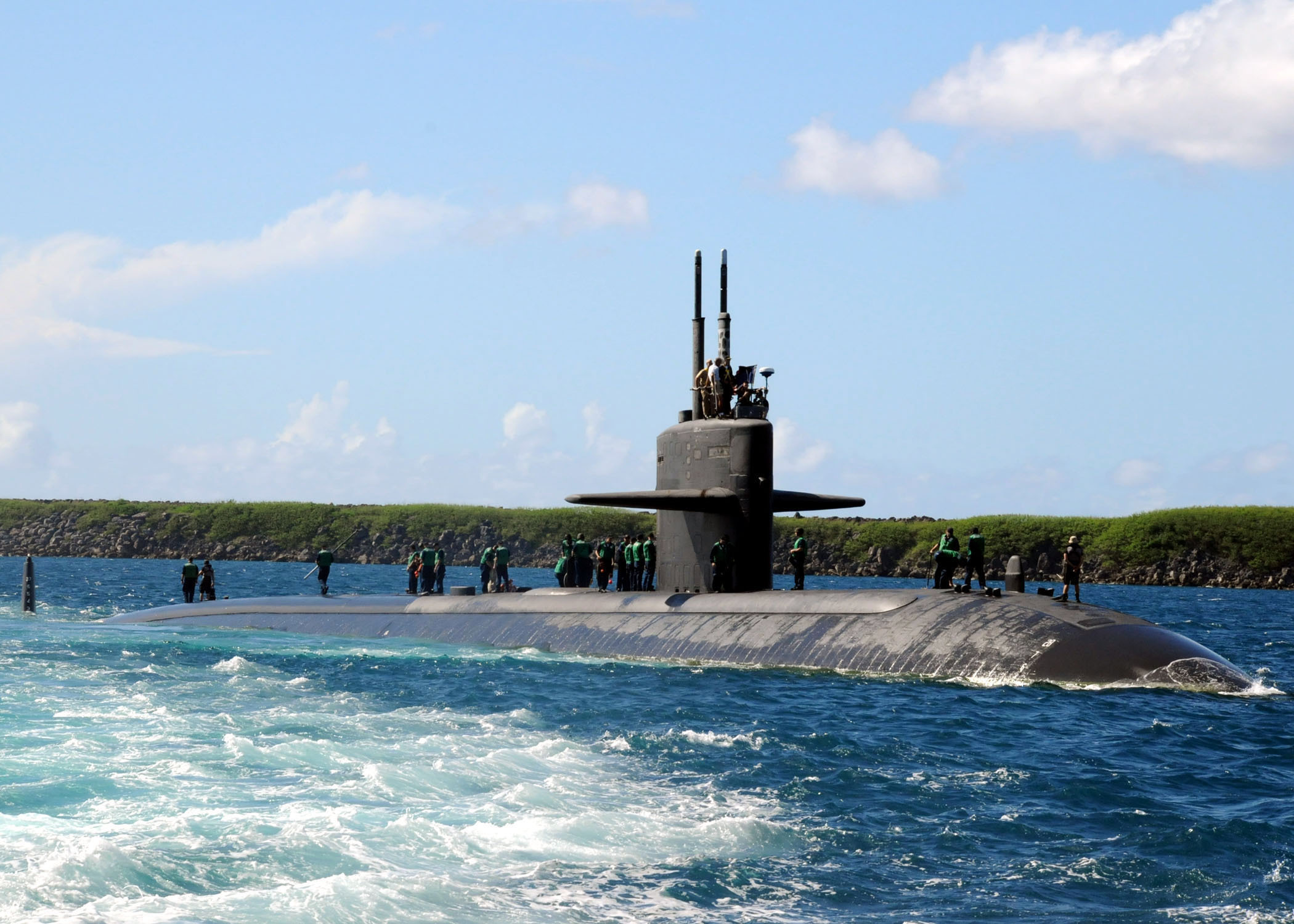 The fast-attack submarine USS Los Angeles transits near Apra Harbor, Guam after returning from an underway period. Los Angeles, the 4th naval ship to be named after the city of Los Angeles and the lead ship of her class, is on her last deployment. Los Angeles has been operating at sea for 33 years and is scheduled for decommissioning later this year.