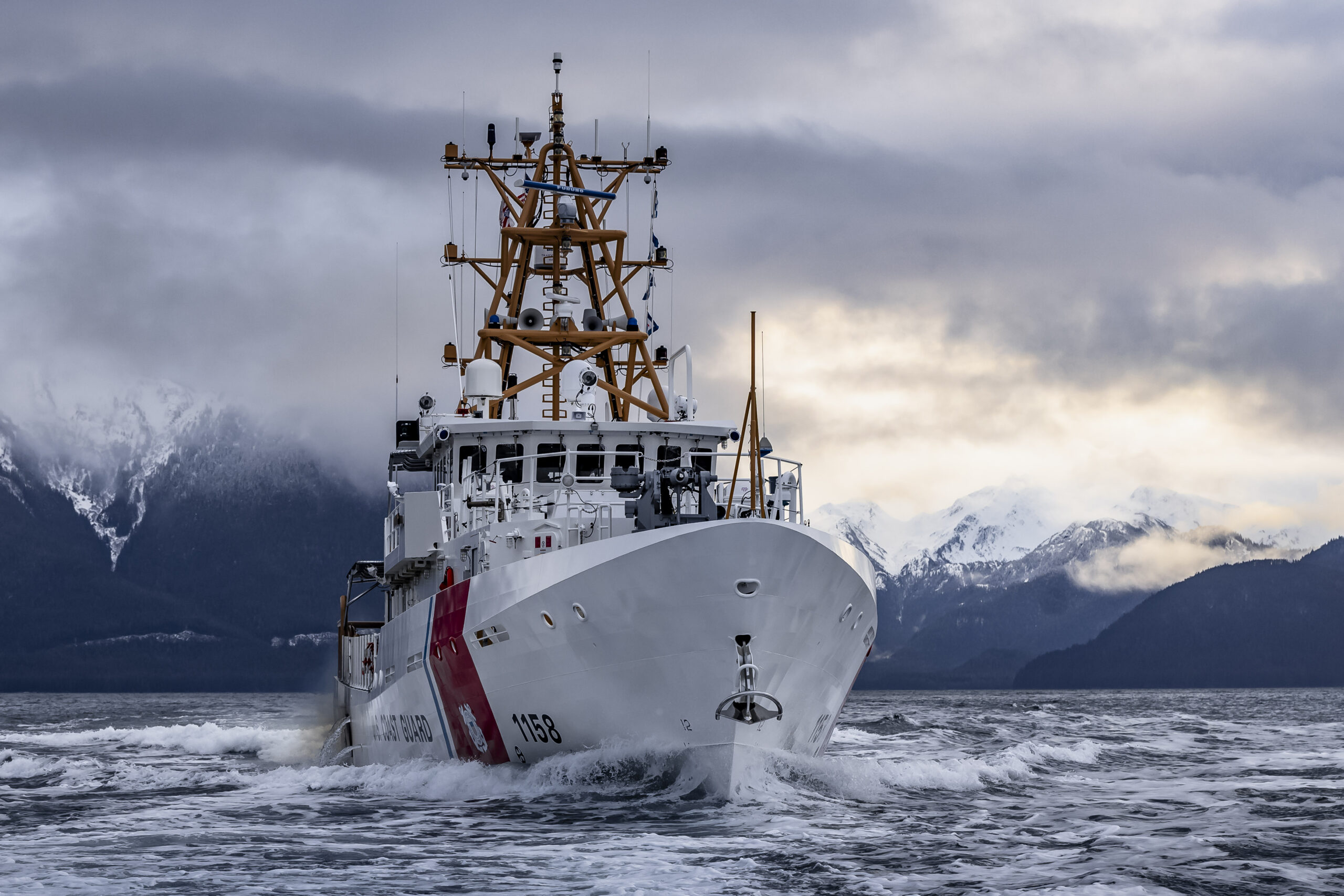 The crew of U.S. Coast Guard Cutter John Witherspoon (WPC 1158) transits in the vicinity of Juneau, Alaska, Jan. 23, 2025. The John Witherspoon is one of three Fast Response Cutters scheduled to commission in Alaska to support missions in search and rescue, living marine resources, and maritime law enforcement. (U.S. Coast Guard photo by Petty Officer 1st Class Logan Hoover)