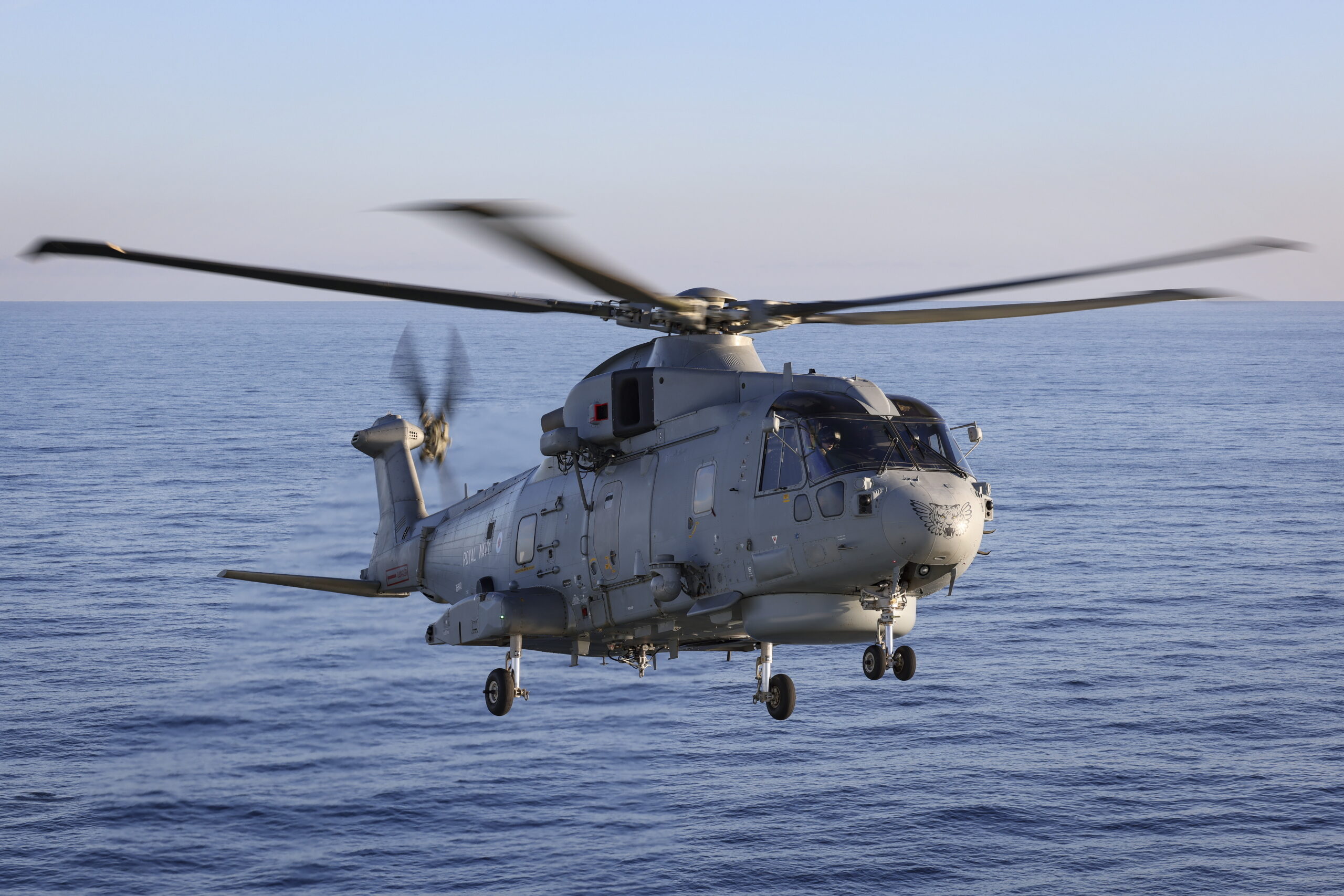 Pictured: A Merlin Mk2 helicopter from 814 Naval Air Squadron operates from the deck of RFA Tidesurge.UK Carrier Strike Group (CSG) units assembled for the start of Exercise Joint Warrior, a UK led exercise forming part of NATO Exercise Steadfast Defender (STDE24). The task group is led by the UKCSG embarked on HMS Prince of Wales, which is operating F-35B jets alongside Merlin and Wildcat helicopters. RFA Tidesurge supports the Carrier Strike Group allowing it to remain at sea for extended periods of time. Exercise Steadfast Defender will be the largest NATO Exercise in decades. NATO will demonstrate the employment of forces across multiple regions and in multiple domains (maritime, land, air, space and cyber). The vast scale of this exercise will occur over several months and over thousands of kilometres, and will involve tens-of-thousands of Allied troops from almost every NATO Ally. In addition, a variety of national training manoeuvres will be integrated into the overall exercise concept. CSG participation in STDE24 is a demonstration of the UK's capabilities and ability to deploy and operate in the harshest of environments and our commitment to NATO's objectives to defend allied territory and deter adversaries.
