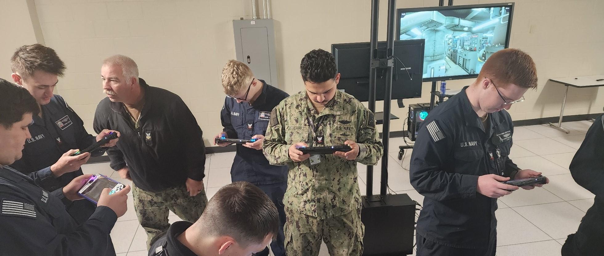 Soldiers testing the Mobile-Navy Enhanced Simulation for Training (Mobile-NEST) handheld devices