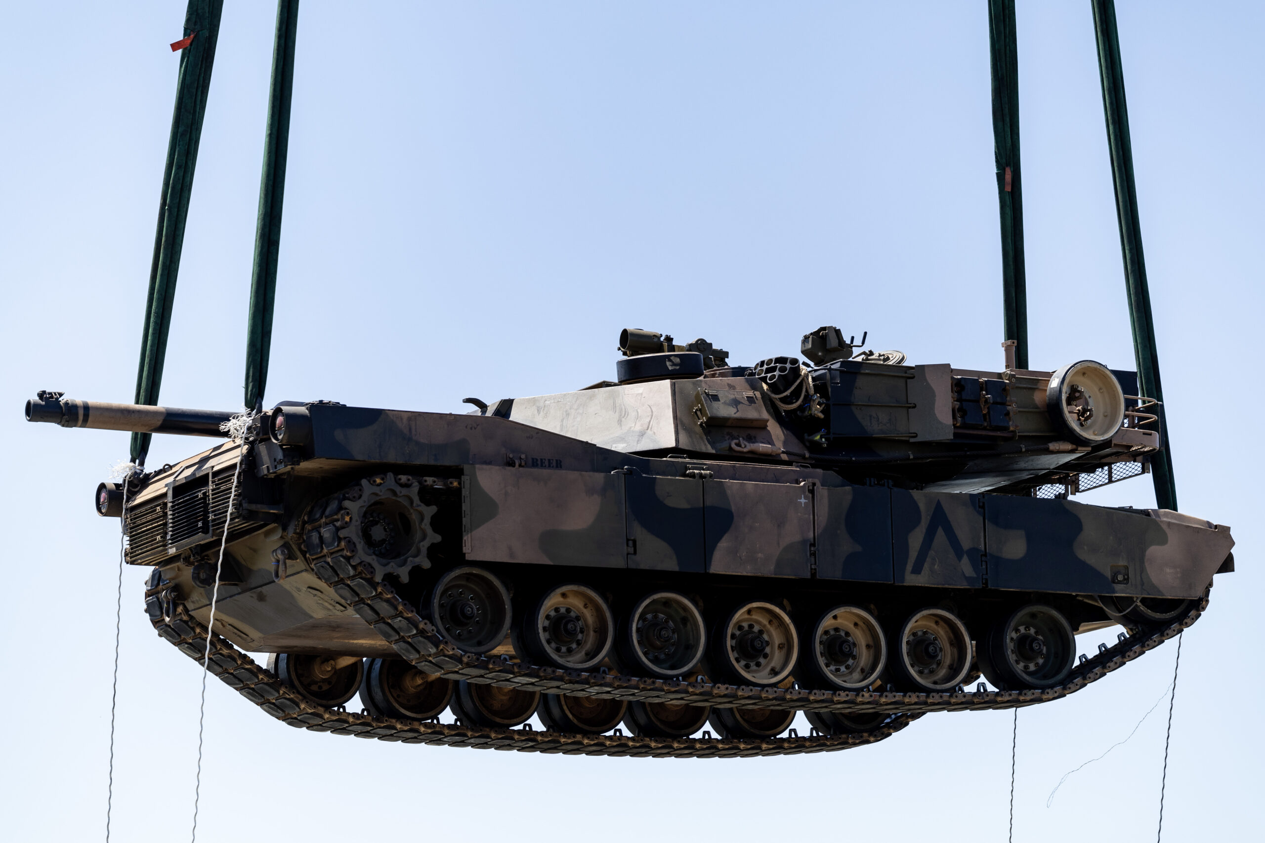 An Australian Army M1A1 Abrams main battle tank is unloaded from the United States Army Vessel SSGT Robert T. Kuroda at Tanjung Perak Port in Indonesia during Exercise Super Garuda Shield 2023. *** Local Caption *** At the invitation of Indonesian Armed Forces (TNI), Australia is contributing over 125 personnel from the Australian Defence Force (ADF) to Exercise Super Garuda Shield 2023 (SGS23). SGS23 is an TNI and United States Indo Pacific Command led bilateral training activity. It is focused on joint operations with international partners in and around East Java in Indonesia from 31 August to 13 September. Held since 2009, the ADF first participated in 2022, and in 2023 is contributing an Australian Army force element including a Troop of M1A1 Abrams tanks from the 1st Armoured Regiment. The contingent also includes an Infantry Platoon from the 10th/27th Battalion, Royal South Australian Regiment, command and control elements, and a range of armoured vehicles, trucks and recovery vehicles.
