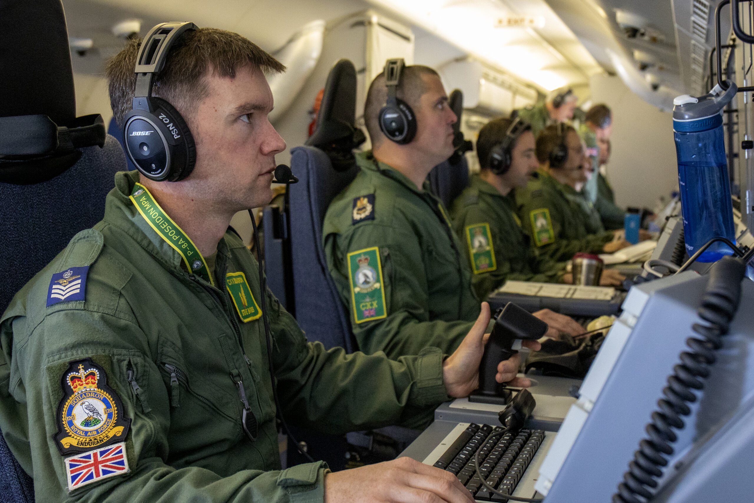 The Station Commander from RAF Lossiemouth, Group Captain Layden, has a flight with 120 Sqn onboard the RAF’s new submarine-hunting Poseidon Maritime Patrol Aircraft (MPA). The Crew, with Wing Commander Hanson are training continuously to begin Operations. The Station Commander, as part of the assessment of how things are progressing observes the Sqn as the carry out a training exercise over the North Sea. The aircraft is part of a new £3 billion programme, including the purchase of nine state-of-the-art Poseidon jets, which will improve the UK’s ability to track hostile targets below and above the waves. Poseidon aircraft will protect the UK’s continuous at-sea nuclear deterrent and be central to NATO missions across the North Atlantic, co-operating closely with the US and Norwegian Poseidon fleets. The UK’s purchase of the Poseidon is in response to increased threats such as Russian submarine activity in the Atlantic returning to Cold War levels, while China is also investing heavily in new Arctic facilities, infrastructure and ice-capable ships.