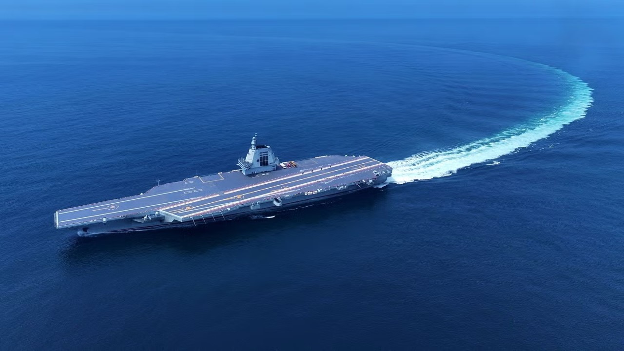 An aerial drone photo taken on May 7, 2024 shows China's third aircraft carrier, the Fujian, during its maiden sea trials. (Photo by Ding Ziyu/Xinhua)