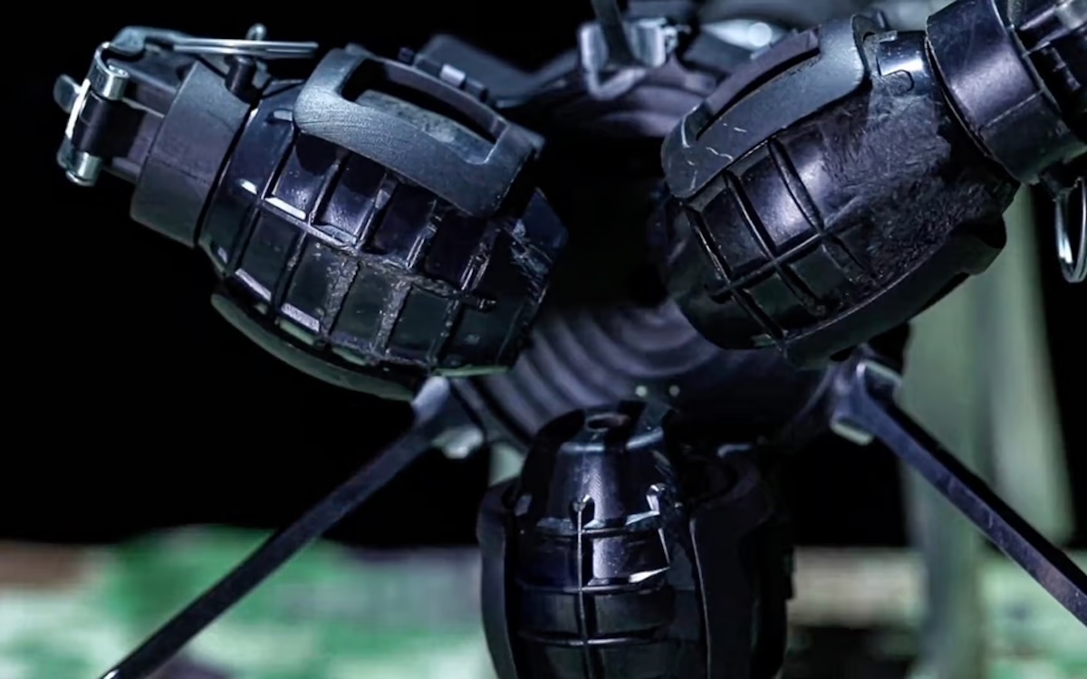China's micro drone carrying three grenades