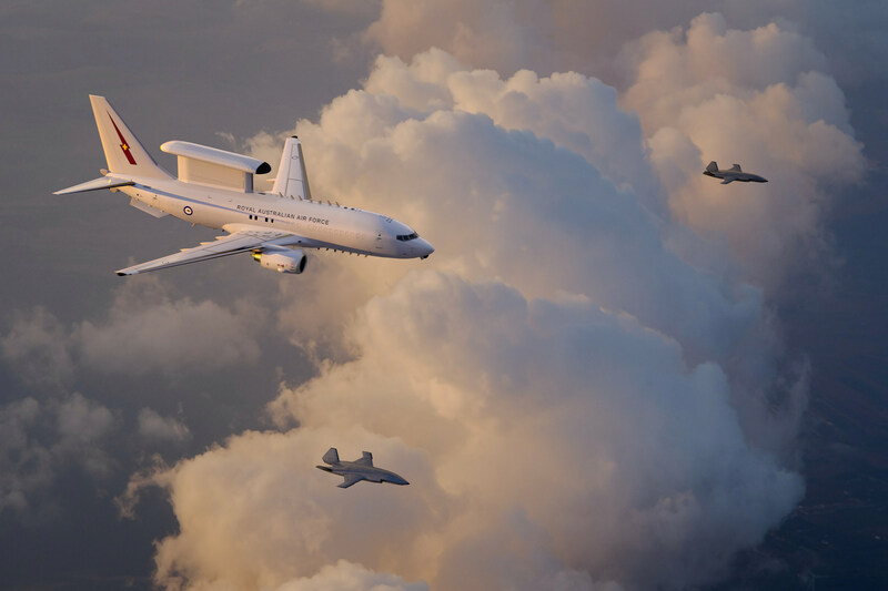 An artist’s rendering of a Royal Australian Air Force E-7A Wedgetail teaming with two MQ-28 Ghost Bat collaborative combat aircraft.