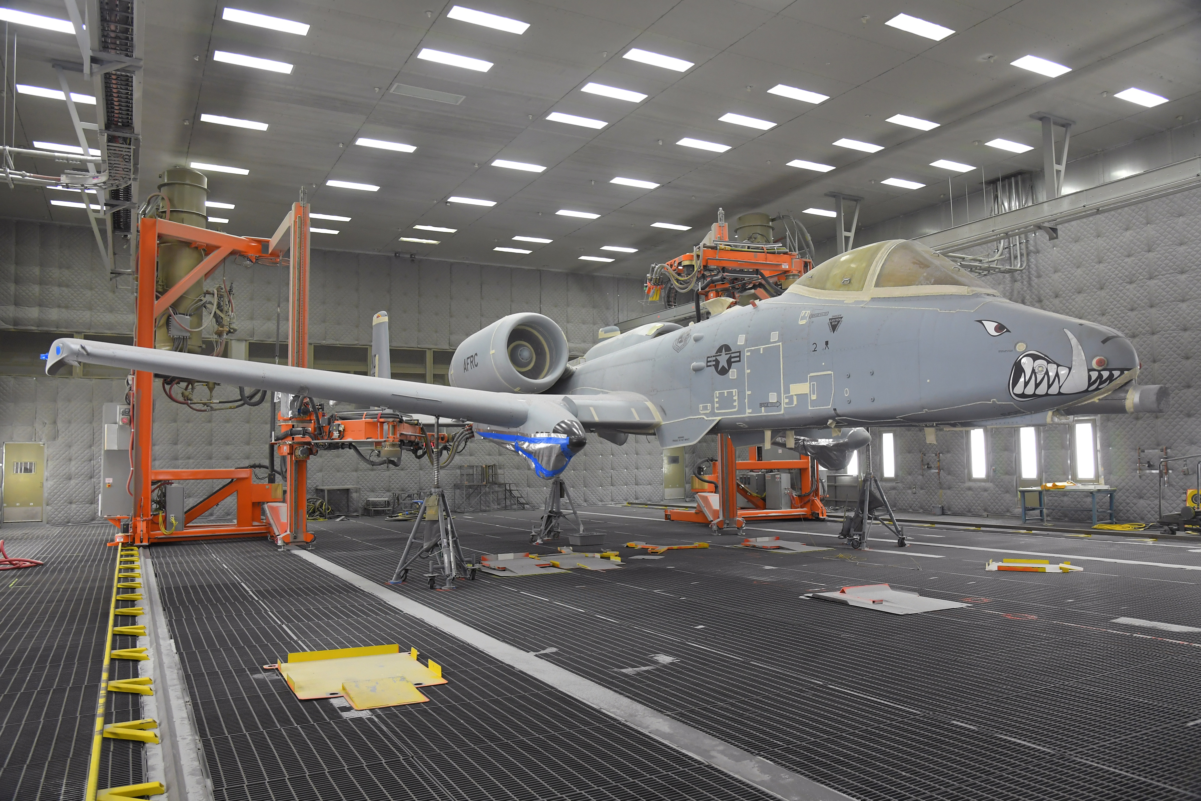 The 576th Aircraft Maintenance Squadron prepares the first production A-10 aircraft for paint removal using a new robotic media blast technology Dec. 4, 2019, at Hill Air Force Base, Utah. The aircraft is prepared by sealing up all seams and holes in the outer surface skin to prevent the blast media from entering the aircraft. (U.S Air Force photo by Todd Cromar)