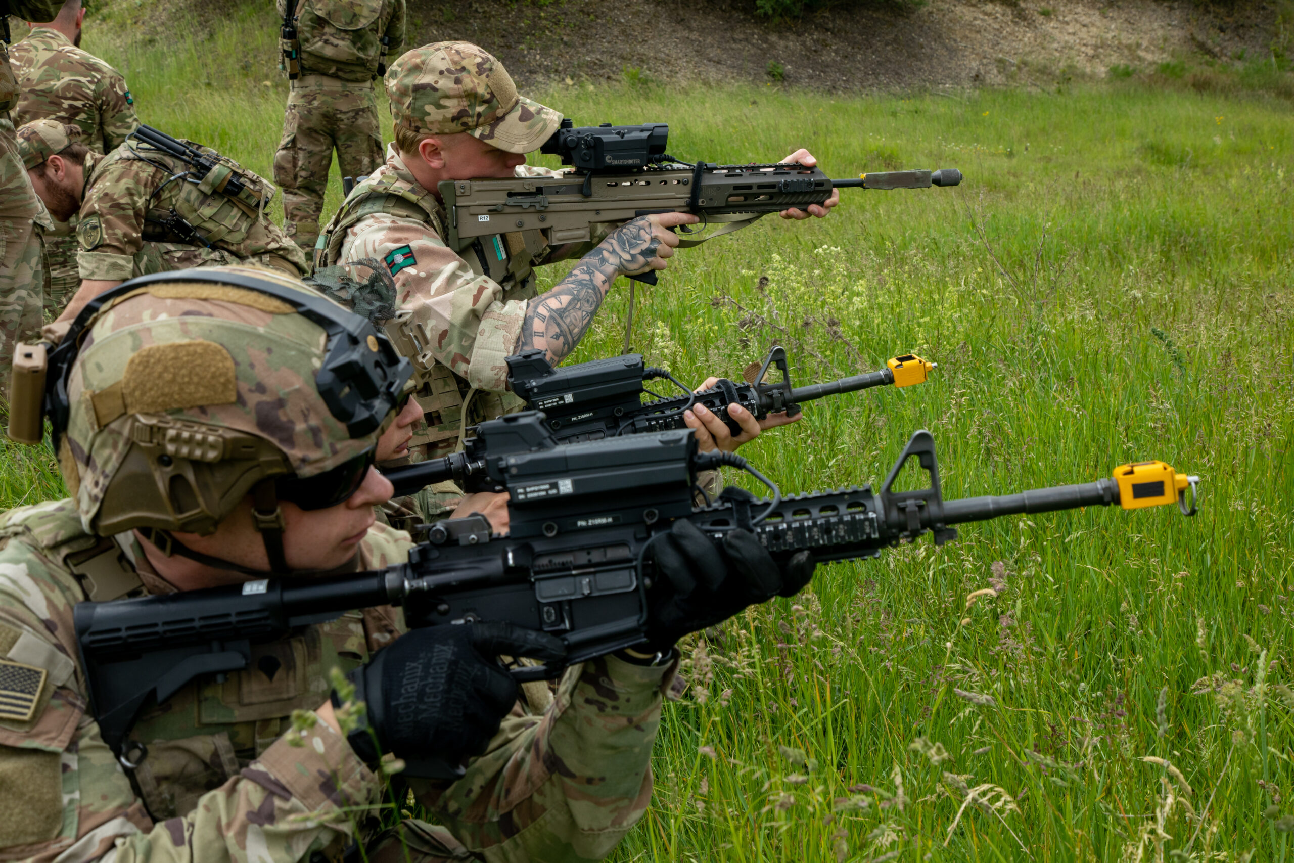 U.S. Soldiers assigned to 3rd Squadron, 2nd Cavalry Regiment and British Army soldiers, assigned to Royal Yorkshire Regiment, identify nearby drones using Smartshooter attachments on their rifles during Project Flytrap at Joint Multinational Readiness Center, Hohenfels Training Area, Hohenfels, Germany, June 6, 2025. Project Flytrap is a series of CUAS training scenarios that test the capabilities of new, lower-cost and portable technology against adversary drone threats. (U.S. Army photo by Pfc. Brent Lee)