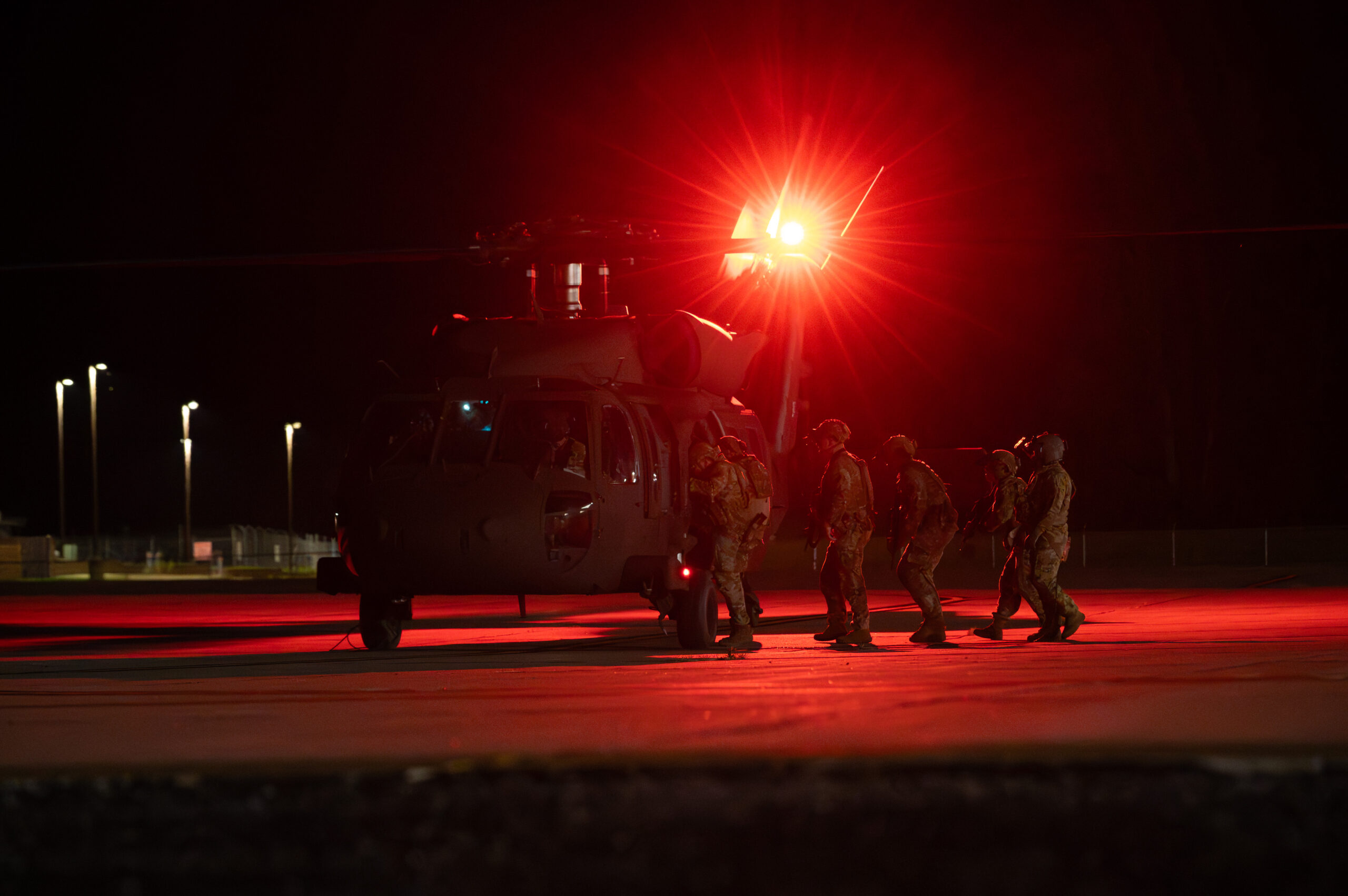 Defenders assigned to the 509th Security Forces Squadron load into a UH-60 Black Hawk helicopter piloted by the Missouri Army National Guard 1-135 Assault Helicopter Battalion at Whiteman Air Force Base, Missouri, June 5, 2025. The 1-135 AHB supported a joint force exercise with defenders assigned to 509th SFS. (U.S. Air Force photo by Senior Airman Joseph Garcia)