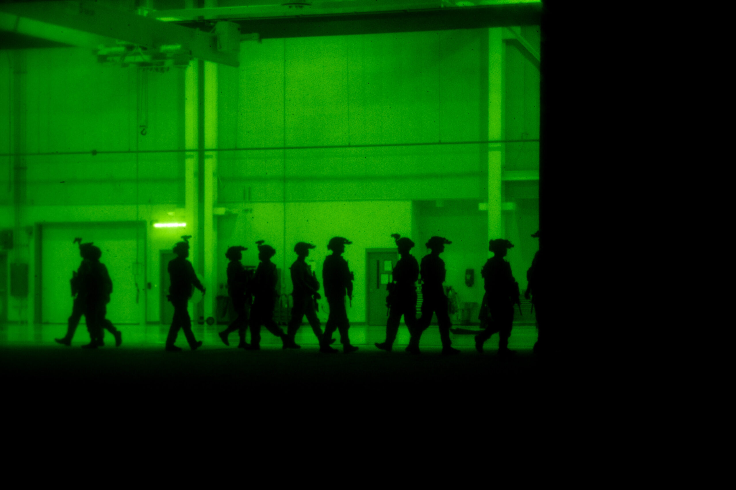 Defenders assigned to the 509th Security Forces Squadron train with night vision at Whiteman Air Force Base, Missouri, June 5, 2025. The exercise prepared the 509th SFS Base Response Team for loading and unloading onto U.S. Army UH-60 Black Hawk helicopters during night operations. (U.S. Air Force photo by Senior Airman Joseph Garcia)