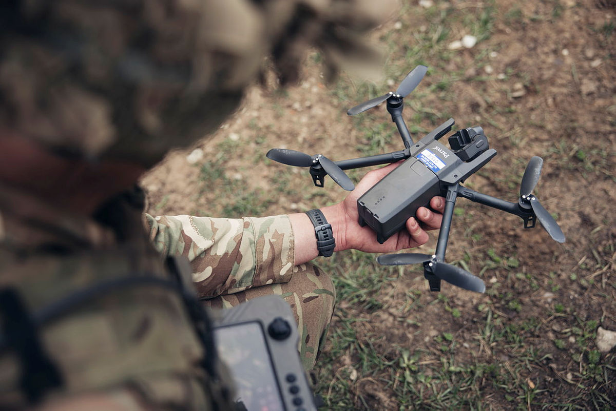 A British soldier operating a parrot drone during exercise HEDGEHOG.