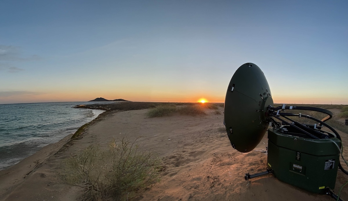 Archer Troposcatter technology on the ground facing the sunset