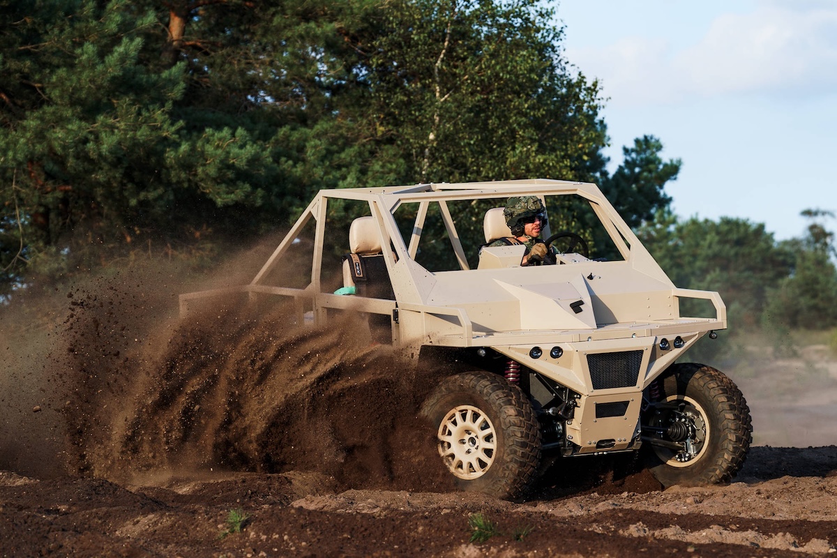 A soldier driving an Ermine ground vehicle