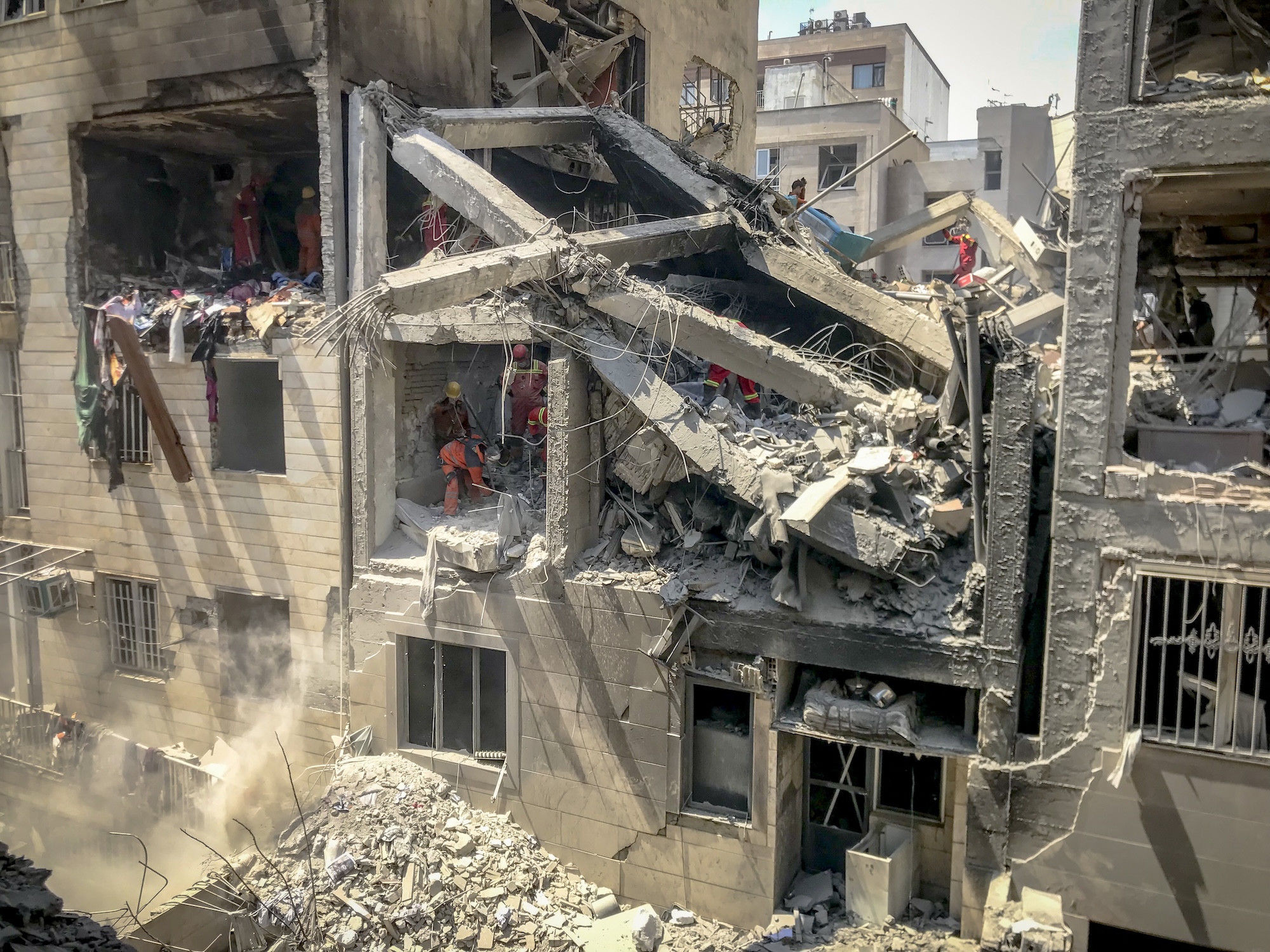 Photo from inside a house across a targeted residential building shows extensive damage in Tehran, Iran, on June 13, 2025