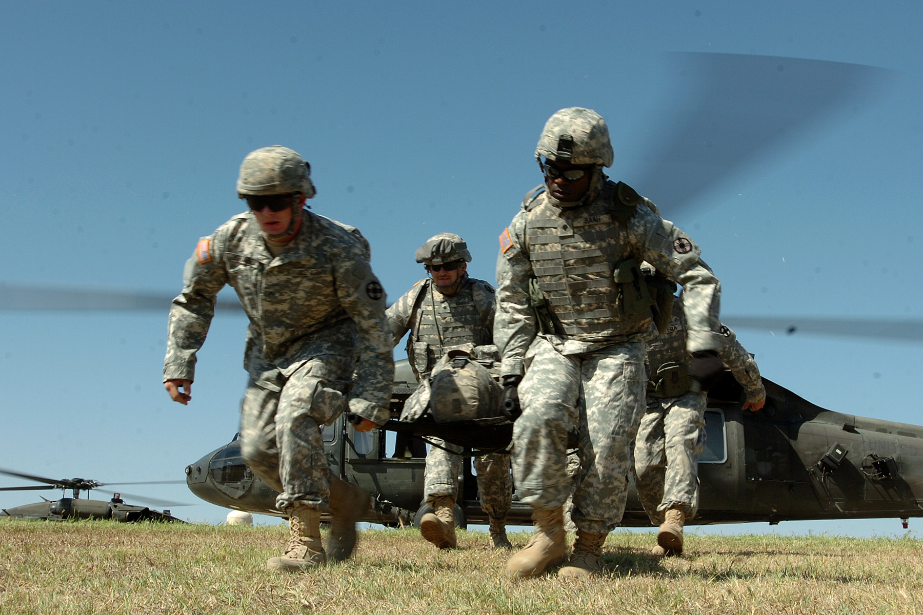 Soldiers from the 154th Transportation Company, 180th Transportation Battalion, 15th Sustainment Brigade, 13th Sustainment Command (Expeditionary), carry a fellow Soldier away from a medical evacuation helicopter during medevac training on Oct. 2, 2008, at Fort Hood.