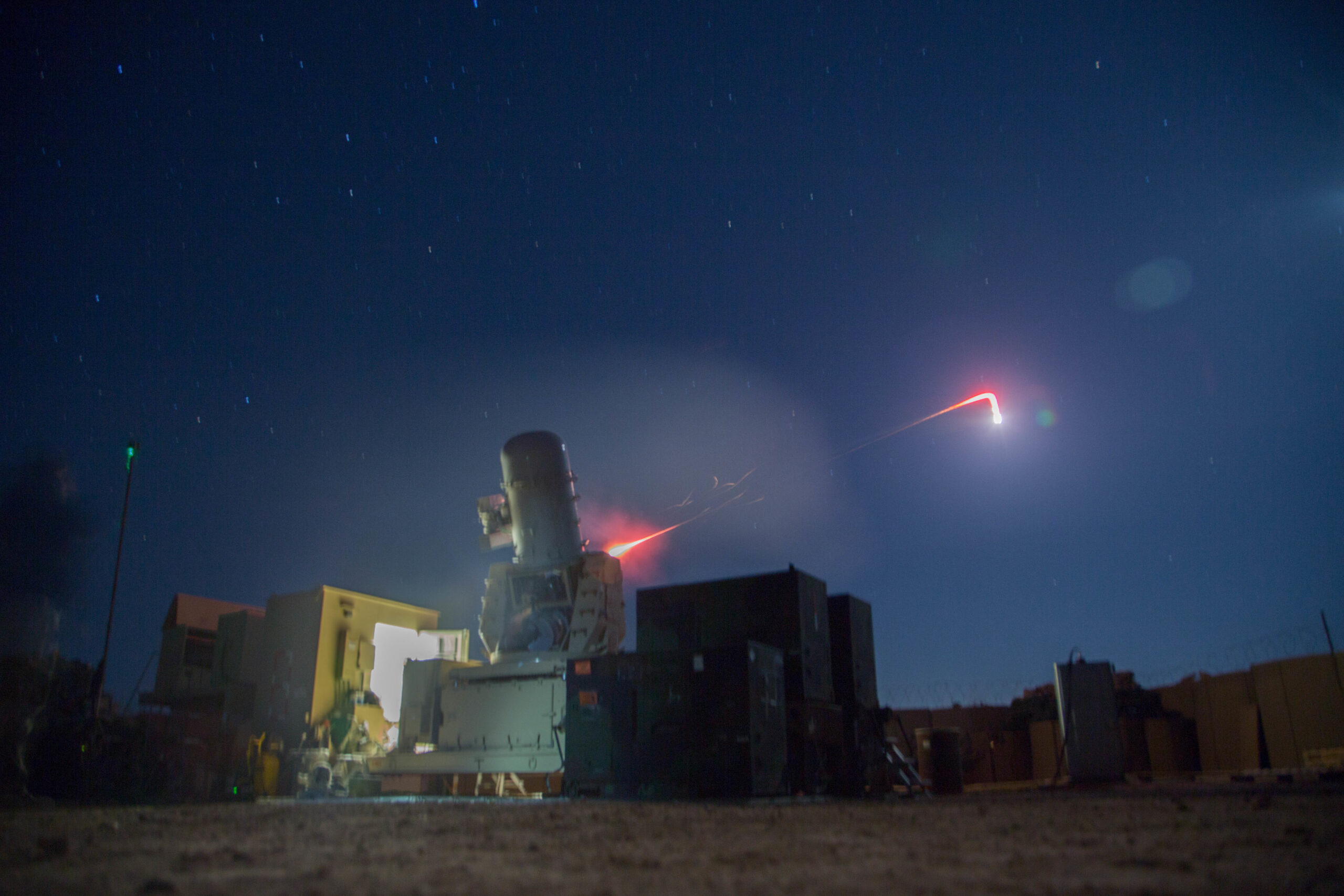 A land–based Phalanx weapons system assigned to B Battery, 5th Battalion, 5th Air Defense Artillery Regiment conducts a test fire mission to maintain mission readiness at Camp Manion, Iraq, Jan. 6, 2017. The LPWS targets and destroys incoming enemy munitions before they are able to cause damage to an area. B Battery, 5th Battalion, 5th Air Defense Artillery Regiment conducted the fire mission in support of Combined Joint Task Force – Operation Inherent Resolve, the global Coalition to defeat ISIL in Iraq and Syria.  (U.S. Army photo by Spc. Christopher Brecht)