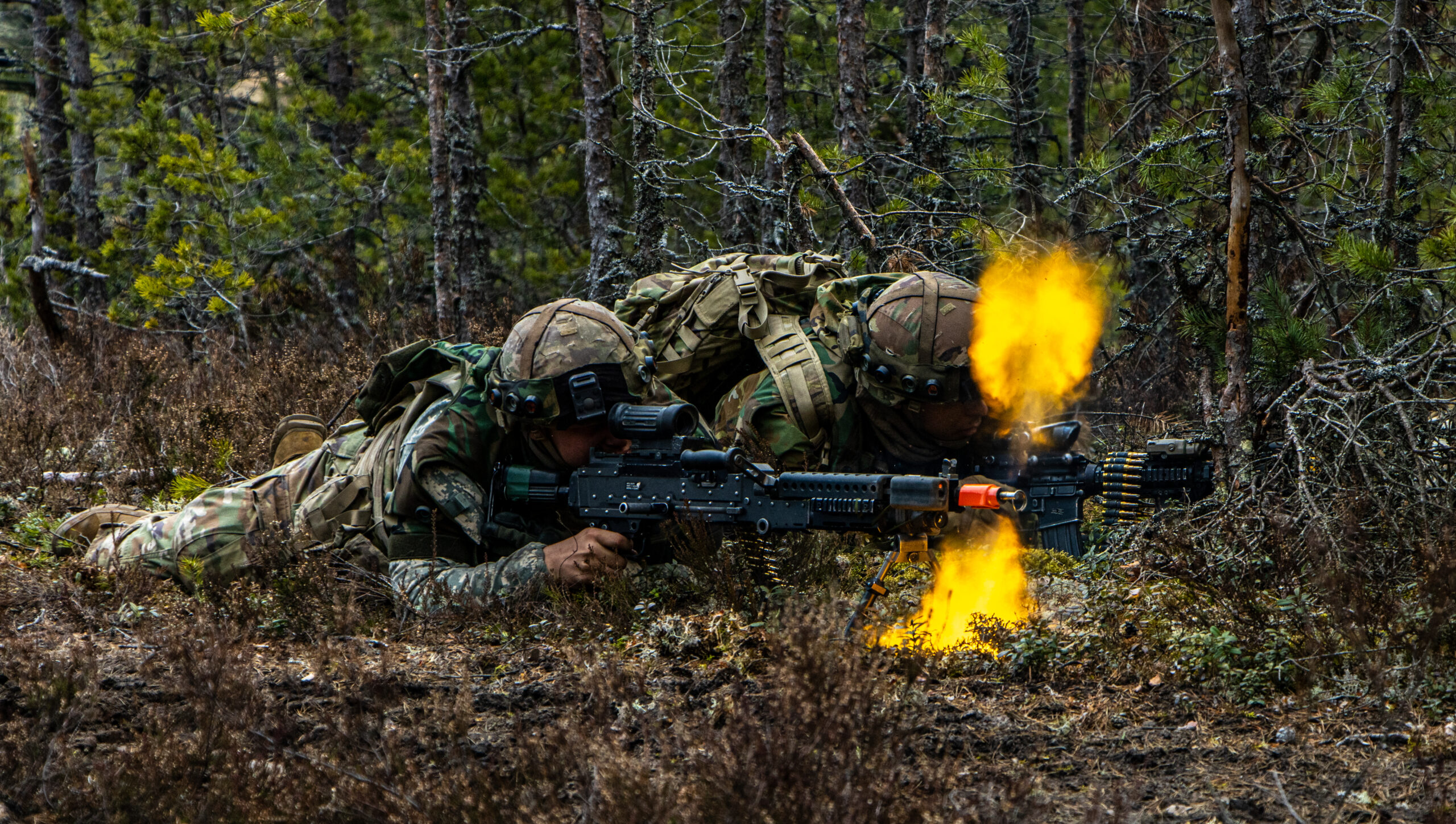 A Trooper, assigned to 1st Battalion, 8th Cavalry Regiment, fires simulated rounds from an M240L Machine Gun during Arrow 23 in Niinisalo Training Area, Finland, May 4, 2023.Exercise Arrow is an annual, multinational exercise involving armed forces from the U.S., U.K., Latvia, Lithuania and Estonia, who train with the Finnish Defense Forces in high-intensity, force-on-force engagements and live-fire exercises to increase military readiness and promote interoperability among partner nations. (U.S. Army Photo by Spc. Jacob Nunnenkamp)
