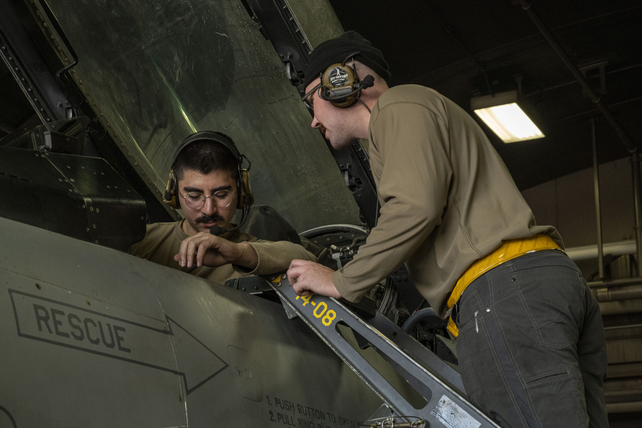Senior Airman Jaderian James, left, 35th Maintenance Squadron Avionics Flight electronic warfare technician, and Senior Airman Izaak Molina, 14th Fighter Generation Squadron avionics technician, examine a U.S. Air Force F-16 Fighting Falcon’s cockpit and controls during a Combat Shield readiness assessment at Misawa Air Base, Japan, Nov. 5, 2024. Combat shield assessments ensure the integration of defensive systems across air, ground, and space platforms, verifying effective coordination and communication to enhance survivability and mission success. (U.S. Air Force photo by Airman 1st Class Patrick Boyle)