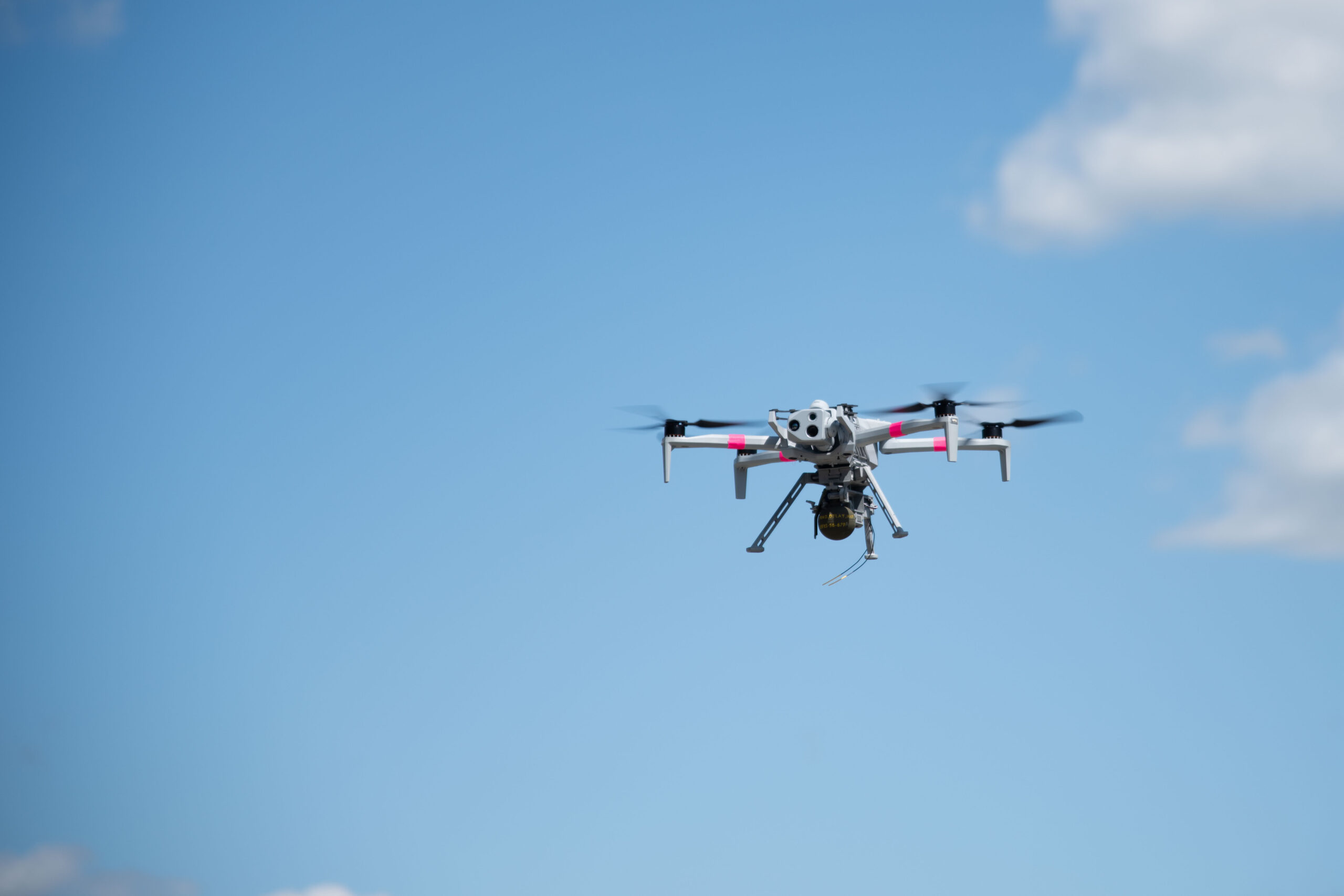 U.S. Army Spc. Michael Fish, a unmanned aircraft system (UAS) operator from the 173rd Airborne Brigade flies a Skydio X10 for a M67 grenade drop in the Grafenwoehr Training Area, Germany, June 25, 2025. Soldiers from 7th Army Training Command, the Joint Multinational Training Group-Ukraine and 173rd Airborne Brigade all worked together to make this the first live grenade drop from a UAS in the U.S. Army for conventional forces. This drop of a live M67 grenade used a Skydio X10 and a U.S. Army Combat Capabilities Development Command-developed Audible dropper for the first time. (U.S. Army photo by Sgt. Collin Mackall)