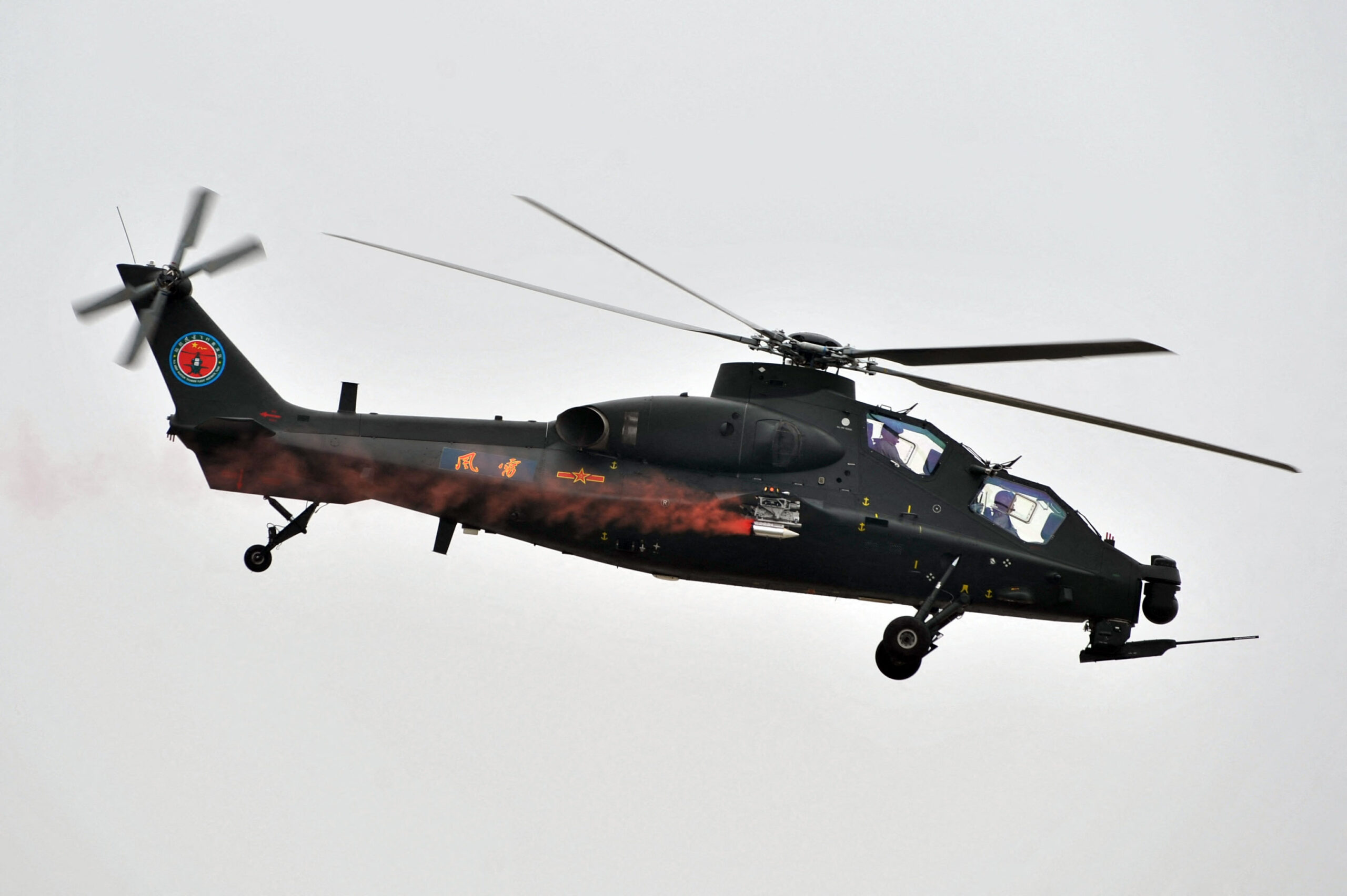 A Chinese WZ-10 attack helicopter performs a flight demonstration at the 2nd China Helicopter Exposition in Tianjin, China, 5 September 2013. The 2nd China Helicopter Exposition, including six flight performances, is being held from September 5 to 8 at Tianjin Airport Economic Zone in Binhai New Area. (Photo by Ke wei / Imaginechina via AFP)