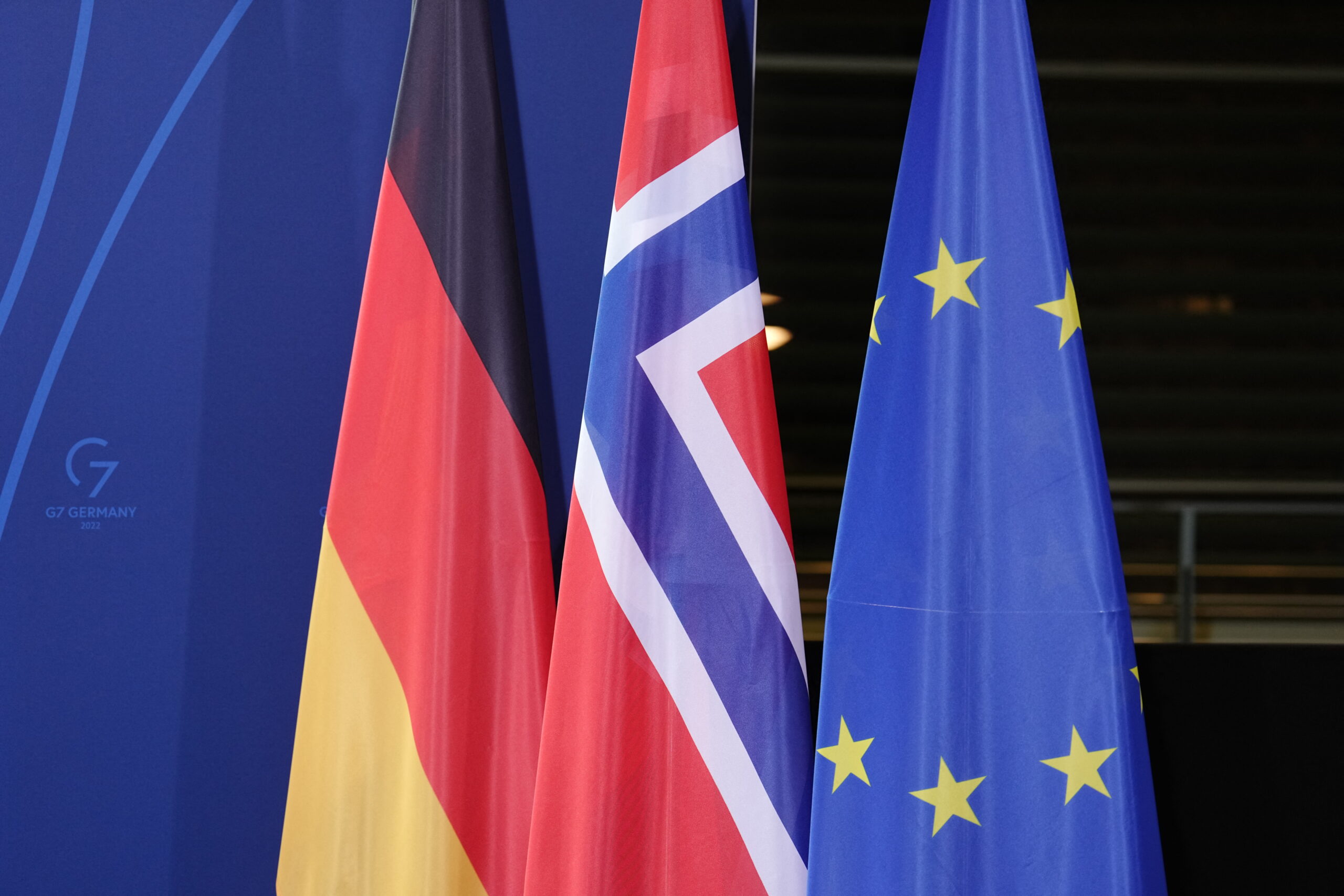 19 January 2022, Berlin: The flags of Germany, Norway and the EU are displayed at the Federal Chancellery. Norway's Prime Minister Store and Chancellor Scholz (SPD) make statements before their joint talks at the Chancellor's Office. Photo: Kay Nietfeld/dpa (Photo by KAY NIETFELD / dpa Picture-Alliance via AFP)