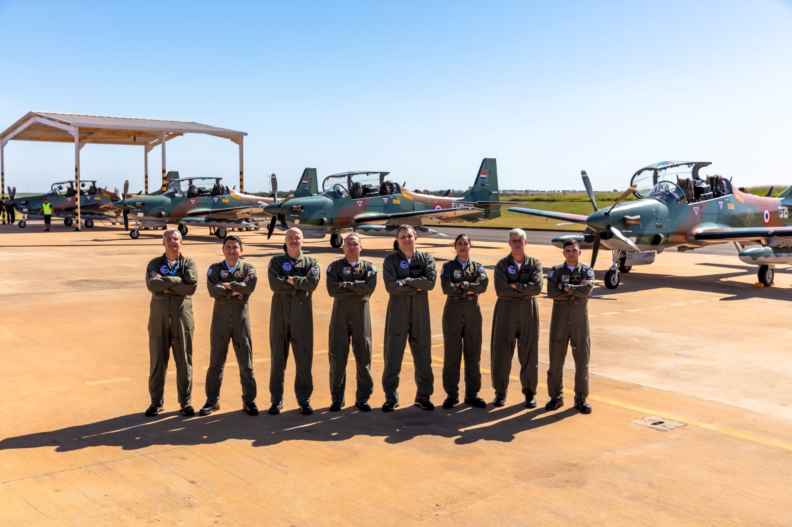 Paraguayan aircrew in front of four new A-29 Super Tucano aircraft
