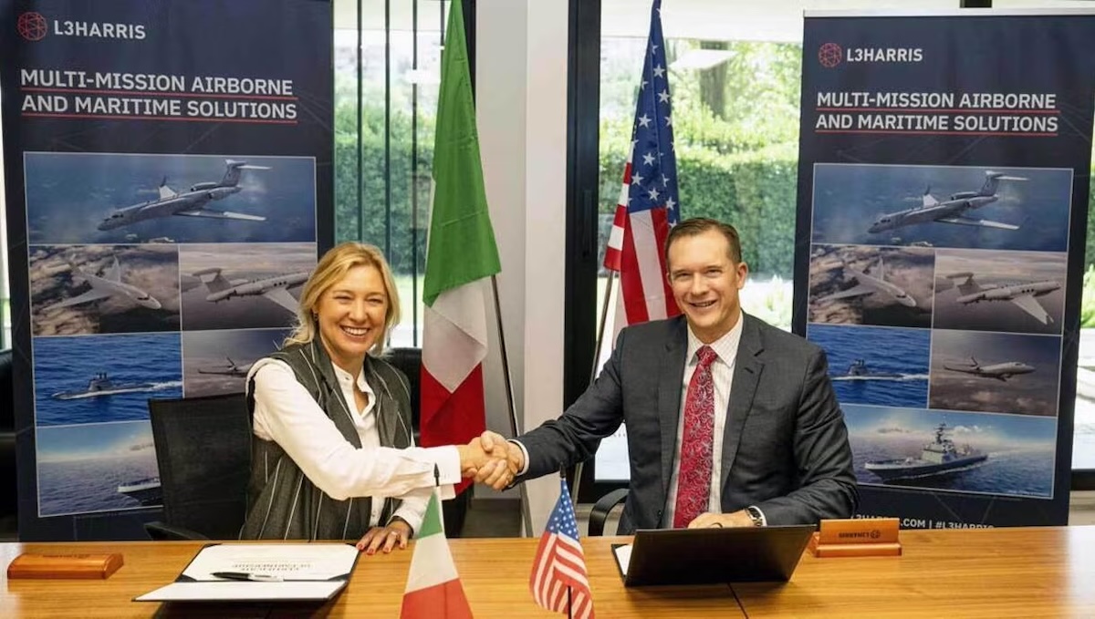 L3Harris Technologies Integrated Mission Systems President Jon Rambeau and ELT Group CEO and COO Domitilla Benigni take part in a ceremonial signing to formalize a new strategic partnership to establish a multi-sensor test facility for commercial, military and government programs. 