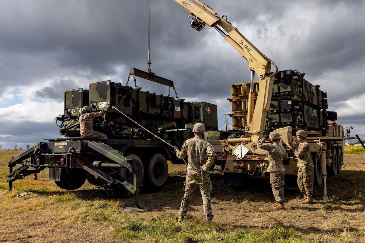 A reload crew of Patriot Launching Station Enhanced Operator and Maintainers with Delta Battery, 1st Battalion, 1st Air Defense Artillery Regiment, 38th ADA Brigade, performs reload operations on their air defense system on Oct. 28, 2024 during the battery's deployment in support of Keen Sword 2025. (Sgt. Connor Davis)