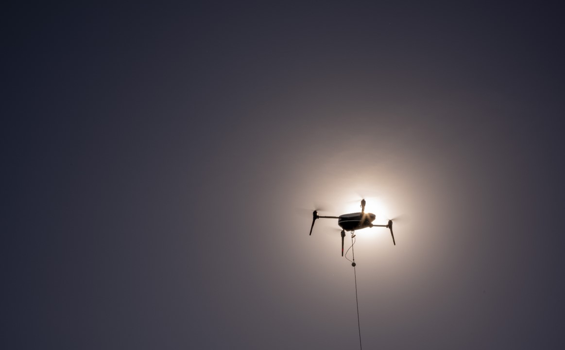 A small drone navigating in the dark.