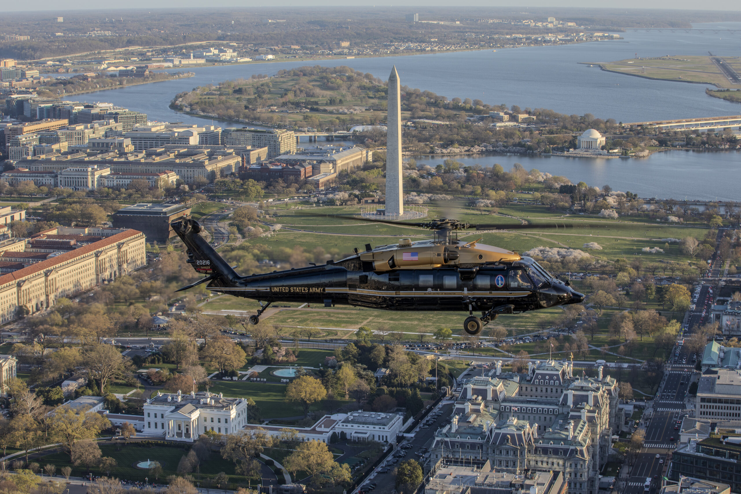U.S. Army Capt. Chris Bissett and Warrant Officer Eric Mendoza, pilots, and U.S. Army Staff Sgt. Daniel Pechacek, crew chief, all assigned to Alpha Company, 12th Aviation Battalion, The Army Aviation Brigade, fly a VH-60M Black Hawk helicopter past the White House, Washington, D.C., March 25, 2024. The 12th Aviation Battalion uses VH-60M 
