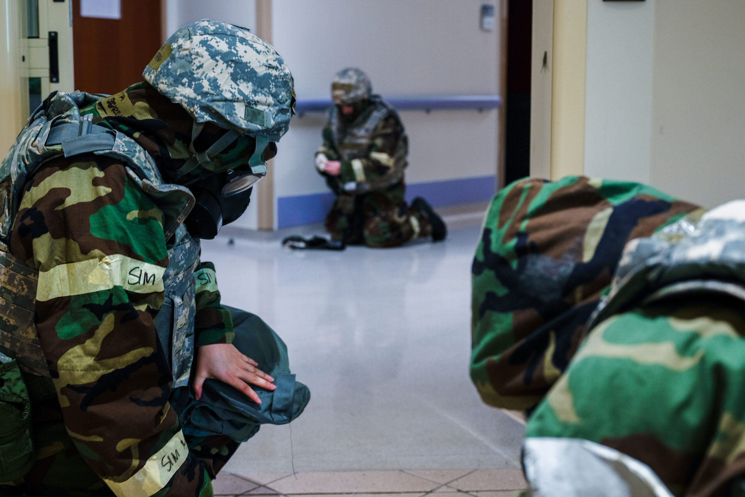 U.S. Air Force Airmen from the 31st Medical Group shelter from a simulated attack during Exercise Fighting Wyvern 25-01 at Aviano Air Base, Italy, March 11, 2025. Fighting Wyvern is a large-scale Combat Readiness Exercise designed to enhance Agile Combat Employment and ensure forces are ready to rapidly deploy, operate and sustain combat airpower under adverse conditions. (U.S. Air Force photo by Airman 1st Class Zachary Jakel)