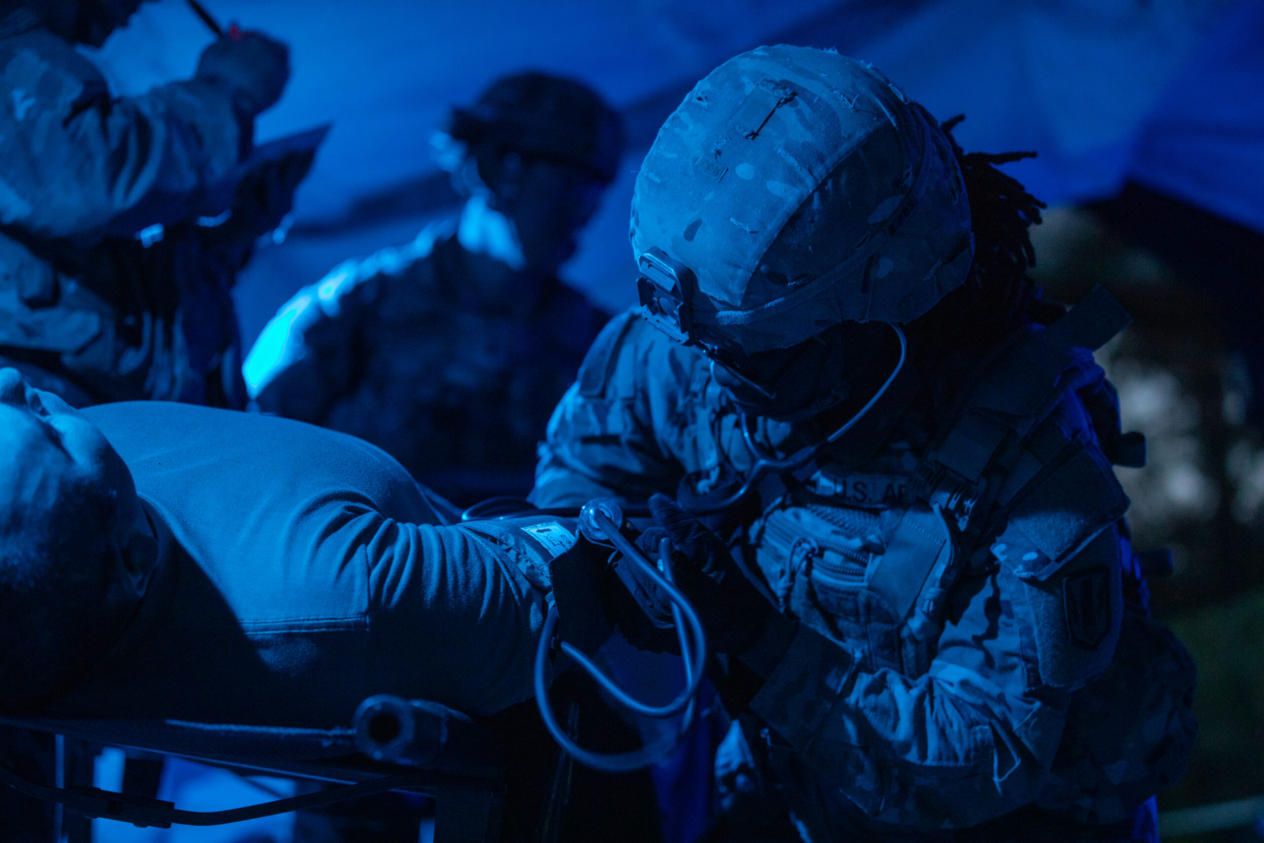 U.S. Army Sgt. Marilyn Harris, assigned to 41st Field Artillery Brigade, listens for a pulse from a battalion aid station after an opposition forces attack during Saber Guardian 25, Cincu Training Area, Romania, June 13, 2025. The aid station enables rapid triage, treatment, and evacuation of casualties, ensuring readiness and lifesaving support in austere operational environments. (U.S. Army photo by Spc. Hunter Carpenter) Demonstrating global deterrence and the U.S. Army’s ability to rapidly deploy U.S.-based combat power in Europe and the Arctic region alongside Allies and partners, DEFENDER 25 brings U.S. troops together with forces from 29 Allied and partner nations to build readiness through large-scale combat training from May 11-June 24, 2025. DEFENDER 25 increases the lethality of the NATO alliance through large-scale tactical training maneuvers and long-range fires, builds unit readiness in a complex joint, multinational environment and leverages host nation capabilities to increase the U.S. Army’s operational reach. During three large-scale combat training exercises—Swift Response, Immediate Response, and Saber Guardian—Ally and partner forces integrate and expand multi-domain operations capability, demonstrating combined command and control structures and readiness to respond to crisis and conflict.