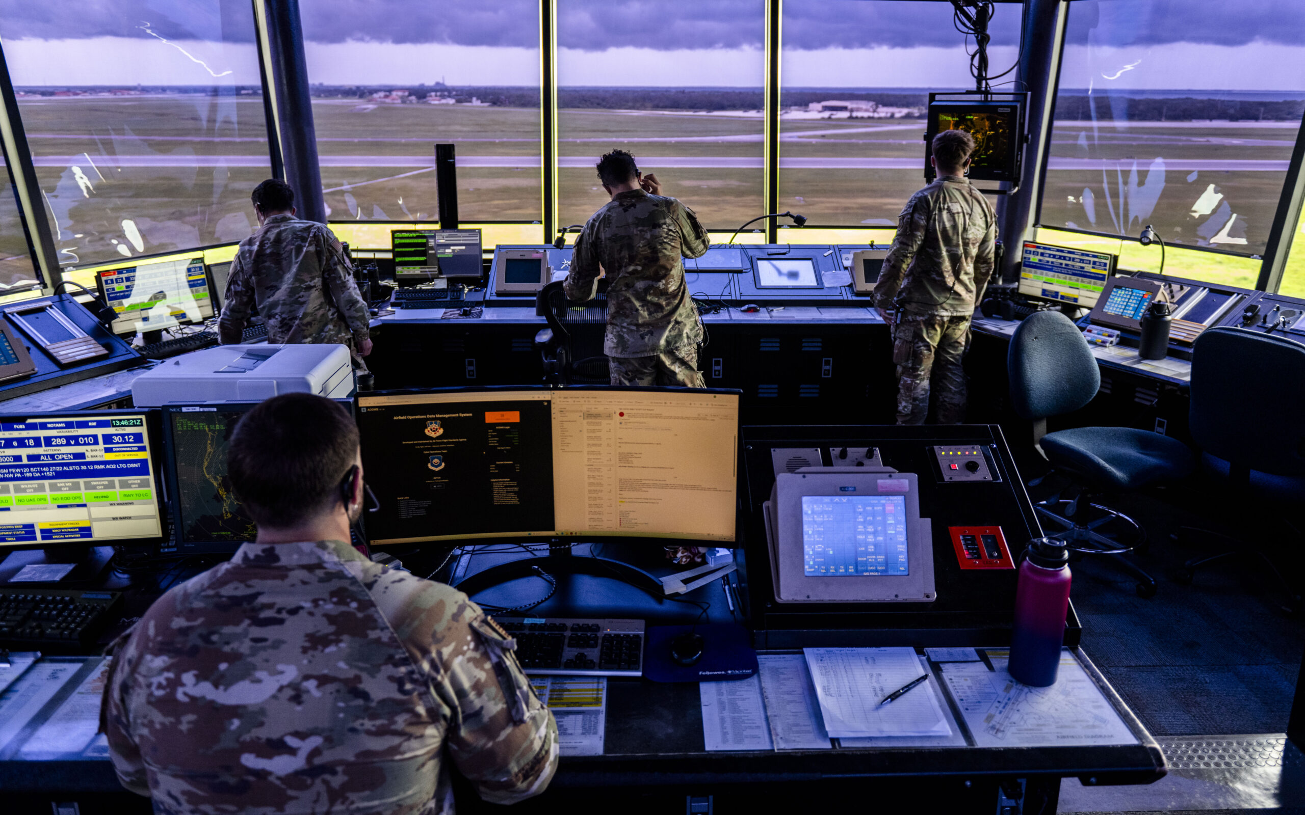 Air traffic controllers (ATCs) assigned to the 6th Operations Support Squadron oversee the safe departure of aircraft at MacDill Air Force Base, Florida, June 30, 2025. ATCs issue precise instructions, coordinate aircraft movements, and efficiently manage the flow of air traffic in and around the tower’s airspace. (U.S. Air Force photo by Airman 1st Class Monique Stober)