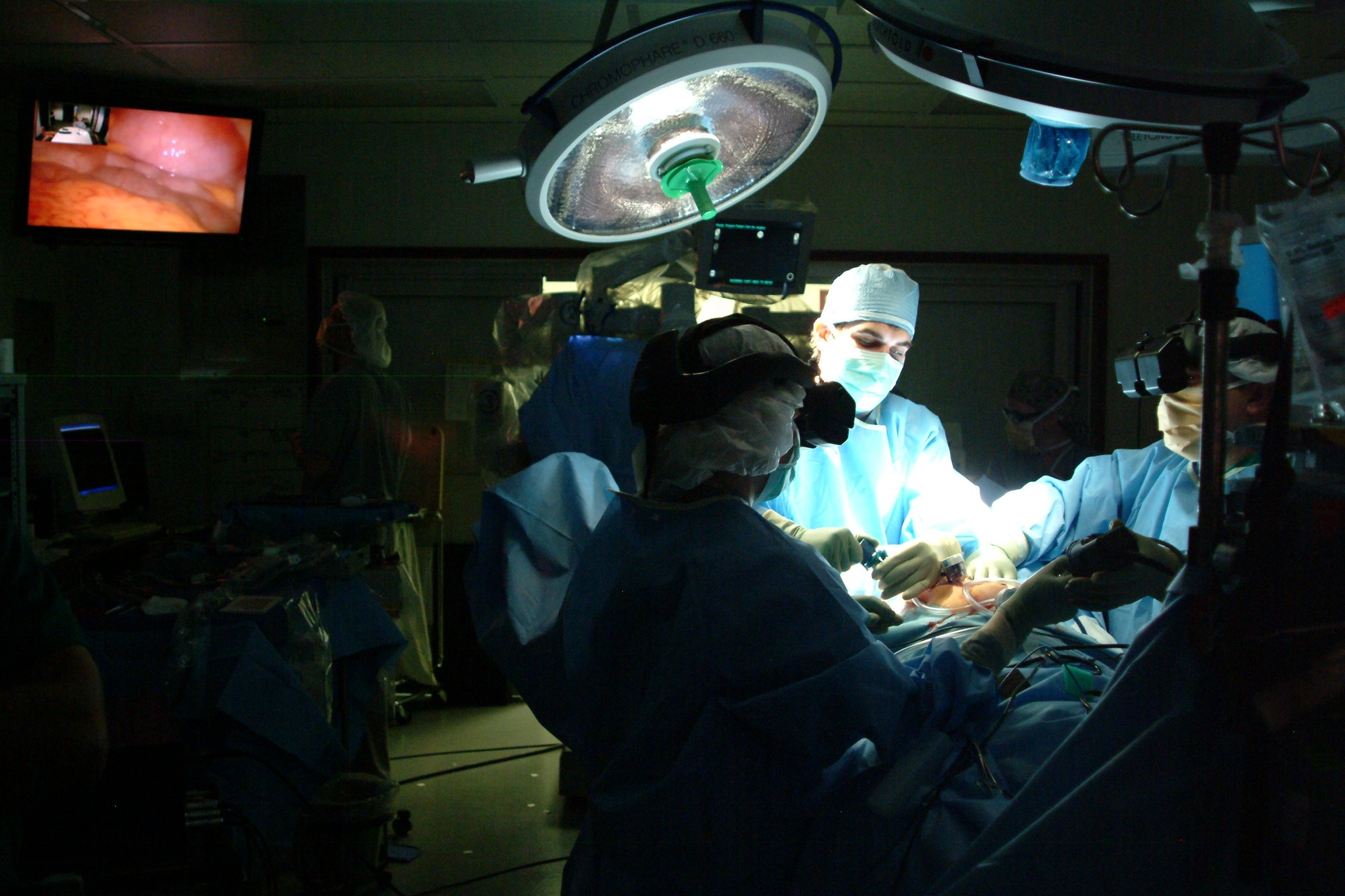 A medical team performs three-dimensional minimally invasive surgery at Walter Reed Army Medical Center in Washington, D.C. Photo by John Chew