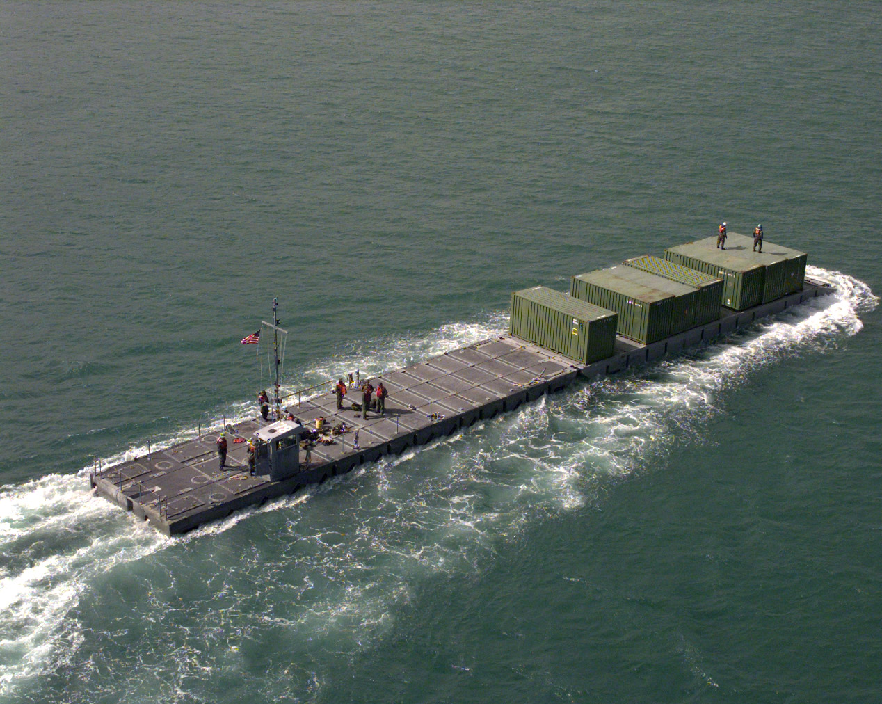 981019-A-6207H-528 A U.S. Army Modular Causeway System transports containers of Army equipment from the USNS Pollux to a pier in the harbor of Pusan, Republic of Korea, on Oct. 19, 1998, for Exercise Foal Eagle Ô98. Foal Eagle Ô98 is a combined, joint exercise supported by forces from the U.S. and Republic of Korea. In addition to providing hands-on field experience for forces of both nations, Foal Eagle Ô98 was designed to test rear area protection operations and major command, control and communications systems. Pollux is one of eight Fast Sealift Ships belonging to the Military Sealift Command that have special features allowing them to load and off-load cargo in places lacking normal port facilities. Causeway systems are deployable aboard container ships and other cargo vessels as the Pollux. DoD photo by Spc. Christina Ann Horne, U.S. Army. (Released)