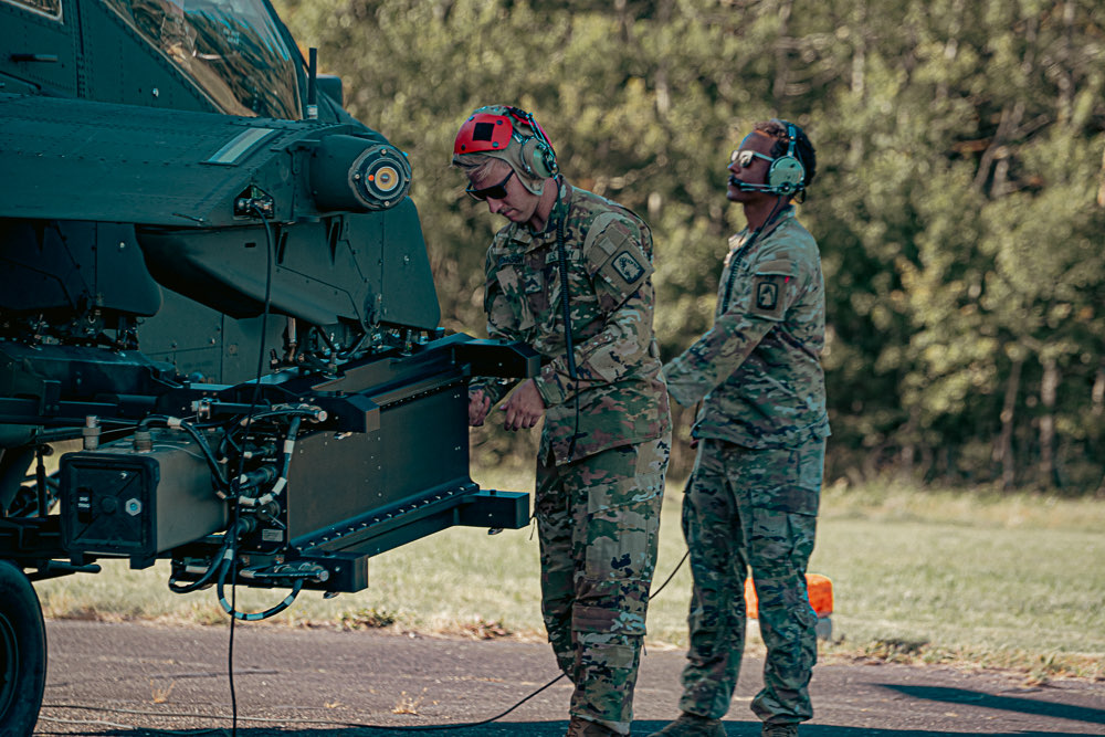 US Army Soldiers of the 12th Combat Aviation Brigade prepare to test fire a Spike non-line of site (NLOS) missile from an AH-64 Apache helicopter. Photo: Lt. Col. Cain Claxton/US Army