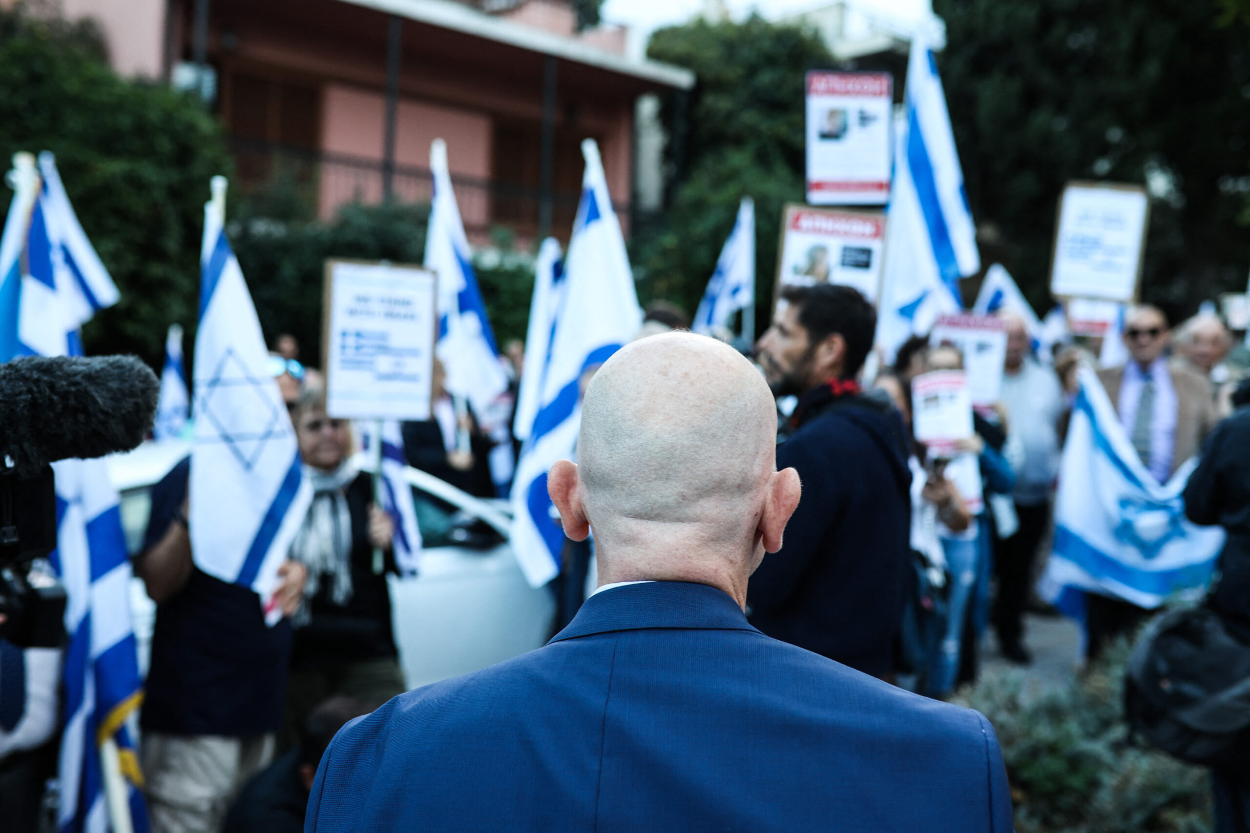 People hold flags during a pro-Israel demonstration outside Israels embassy in Athens, Greece, on Wednesday, Oct. 18, 2023. (Photo by Aris Oikonomou / SOOC via AFP)